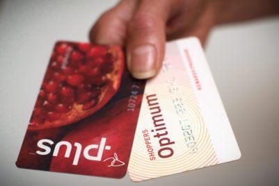 A Loblaws PC Plus and a Shoppers Drug Mart Optimum card are shown together in Toronto on Tuesday. Nov. 7. Loblaw Companies Ltd. (TSX:L) says it will merge Shoppers Optimum points and PC Plus points under the name PC Optimum starting in February. THE CANADIAN PRESS/Graeme Roy