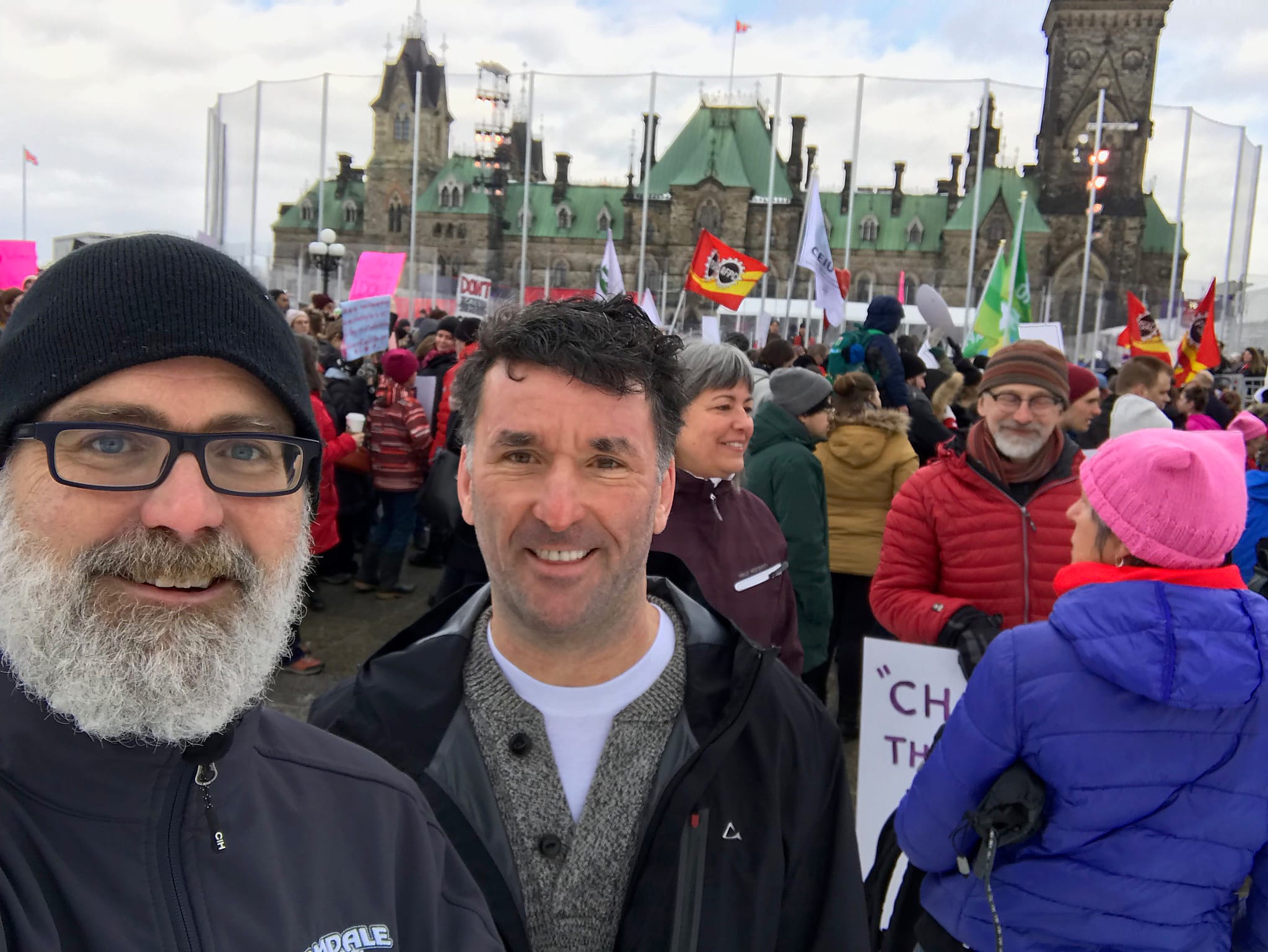 Jeff Leiper (left) and Paul Dewar (right) at the 2018 Women's March in Ottawa.