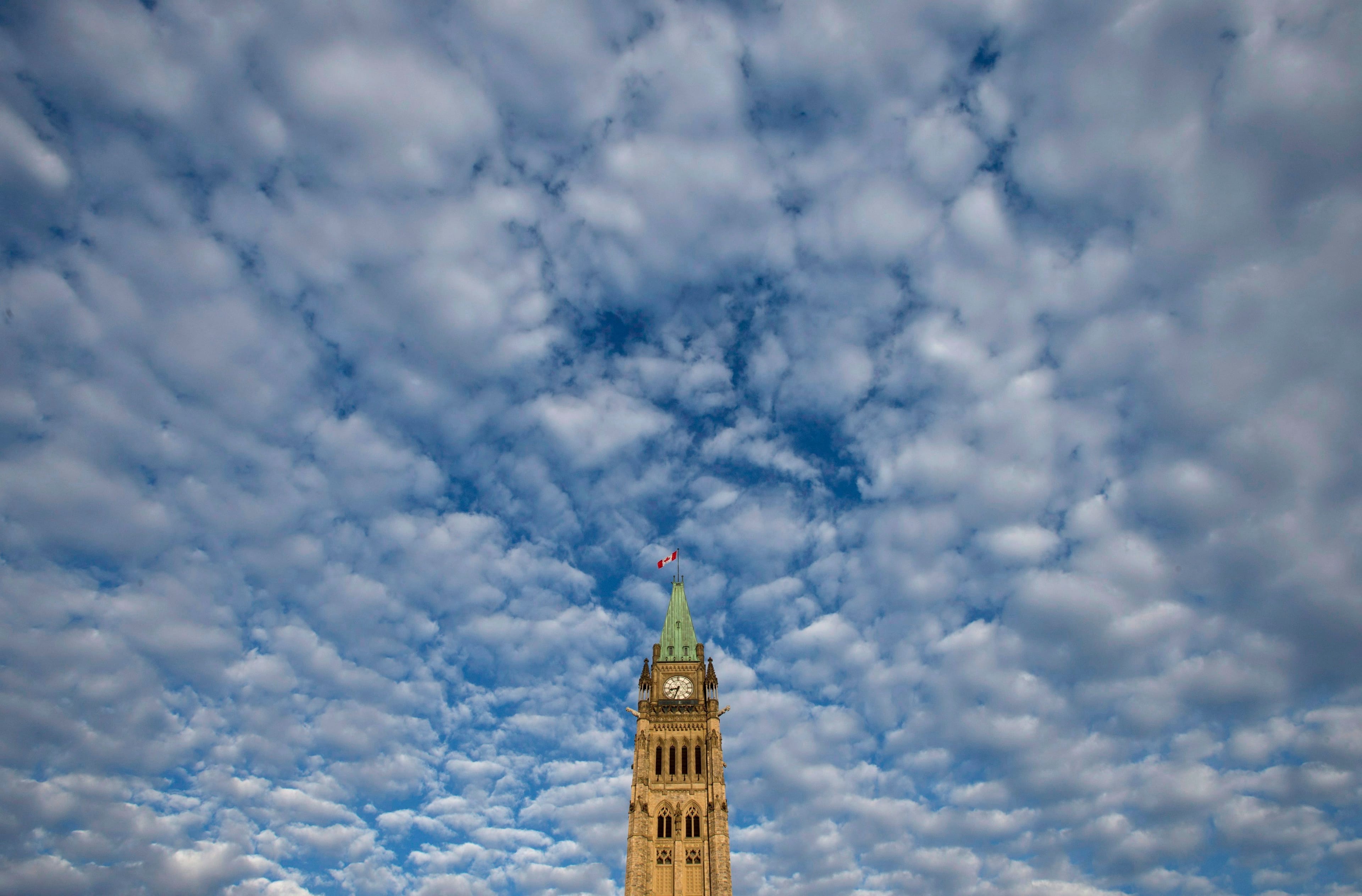 Clouds pass by the Peace Tower on Parliament Hill in Ottawa, Tuesday, November 28, 2017. (Adrian Wyld/CP)
