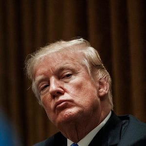 President Donald Trump pauses during a meeting in the Cabinet Room of the White House, in Washington, Wednesday, Feb. 28, 2018, with members of congress to discuss school and community safety. (AP Photo/Carolyn Kaster)