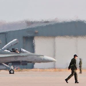 Military personnel prepare for the departure of CF-18 Hornets in support of Operation IMPACT, in Cold Lake, Alberta on Tuesday October 21, 2014. The Canadian CF-18 Hornets are making their way to Kuwait, to join the fight against the Islamic State of Iraq and Syria. THE CANADIAN PRESS/Jason Franson