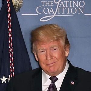 WASHINGTON, DC - MARCH 07:  U.S. President Donald Trump (R) is welcomed to the stage by Latino Coalition Chairman Hector Barreto during the organization's legislative summit at the J.W. Marriott March 7, 2018 in Washington, DC. This was Trump's first time to address the organization of conservative Latino business owners, which is under the leadership of Barreto, former Small Business Administraiton head under George W. Bush.  (Photo by Chip Somodevilla/Getty Images)
