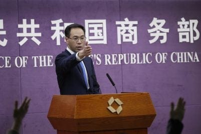 Chinese Ministry of Commerce spokesman Gao Feng gestures as journalists raise hands for questions during a press conference at the Ministry of Commerce in Beijing, Friday, April 6, 2018. China vowed on Friday to fight the U.S. "at any cost" after President Donald Trump added $100 billion in tariffs on Chinese goods, in an escalating trade dispute between the world's two largest economies. (AP Photo/Andy Wong)