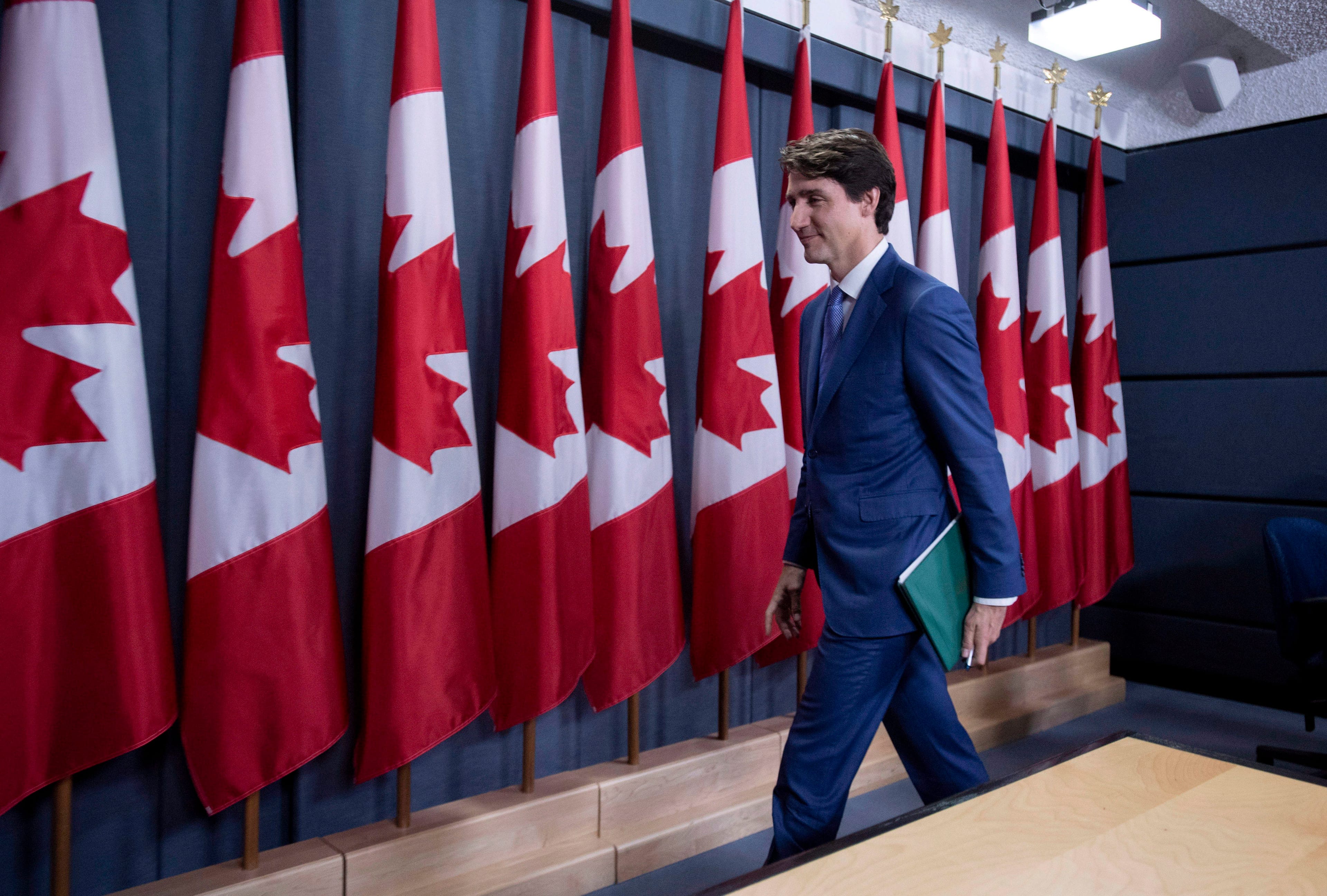 Prime Minister Justin Trudeau leaves a press conference on his meeting with Alberta Premier Rachel Notley and B.C. Premier John Horgan on the deadlock over Kinder Morgan's Trans Mountain pipeline expansion, in Ottawa on Sunday, April 15, 2018. THE CANADIAN PRESS/Justin Tang