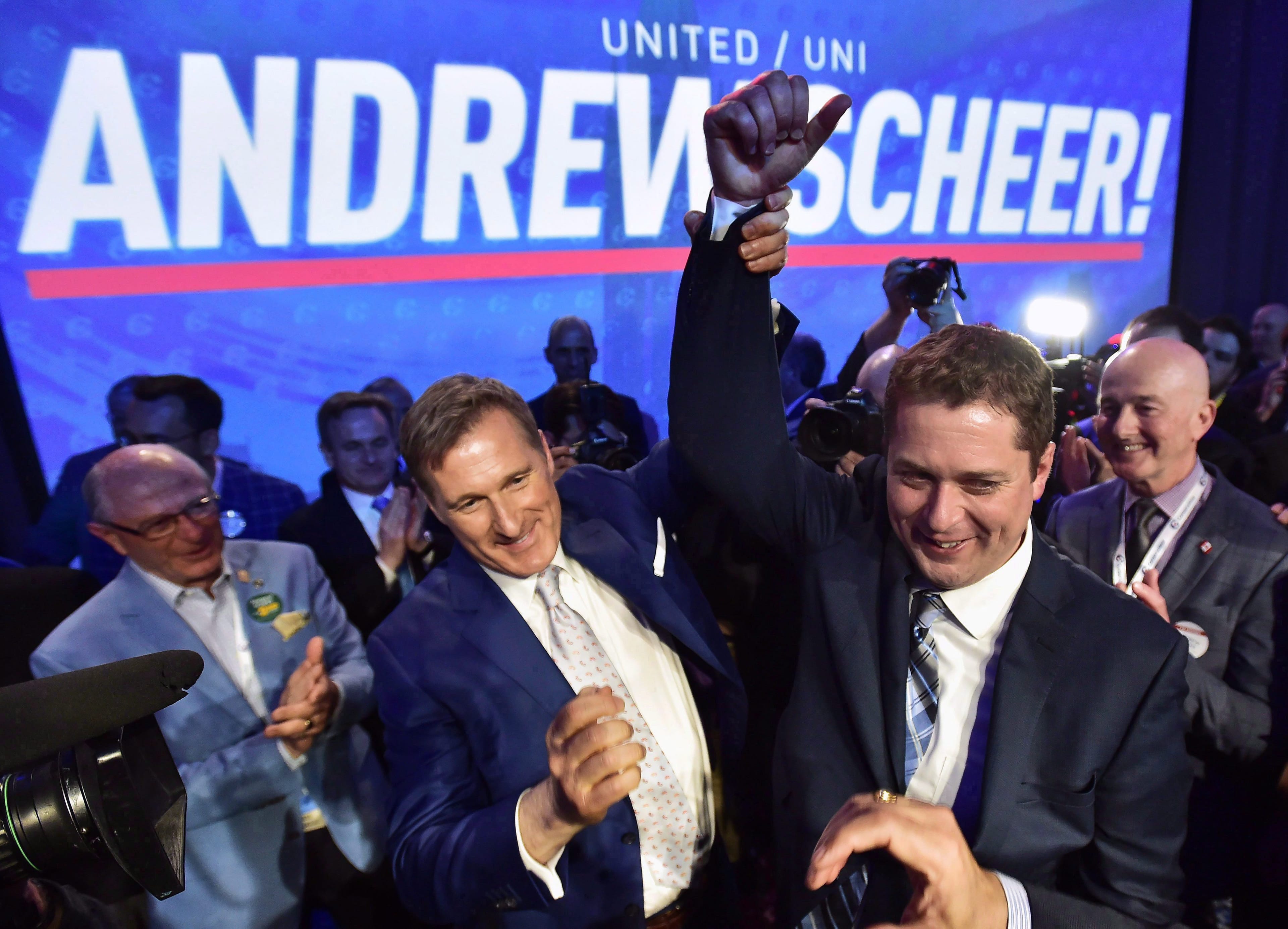 Andrew Scheer, right, is congratulated by Maxime Bernier after being elected the new leader of the federal Conservative party. THE CANADIAN PRESS/Frank Gunn