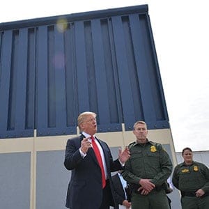 US President Donald Trump inspects border wall prototypes in San Diego, California on March 13, 2018. / AFP PHOTO / MANDEL NGAN        (Photo credit should read MANDEL NGAN/AFP/Getty Images)