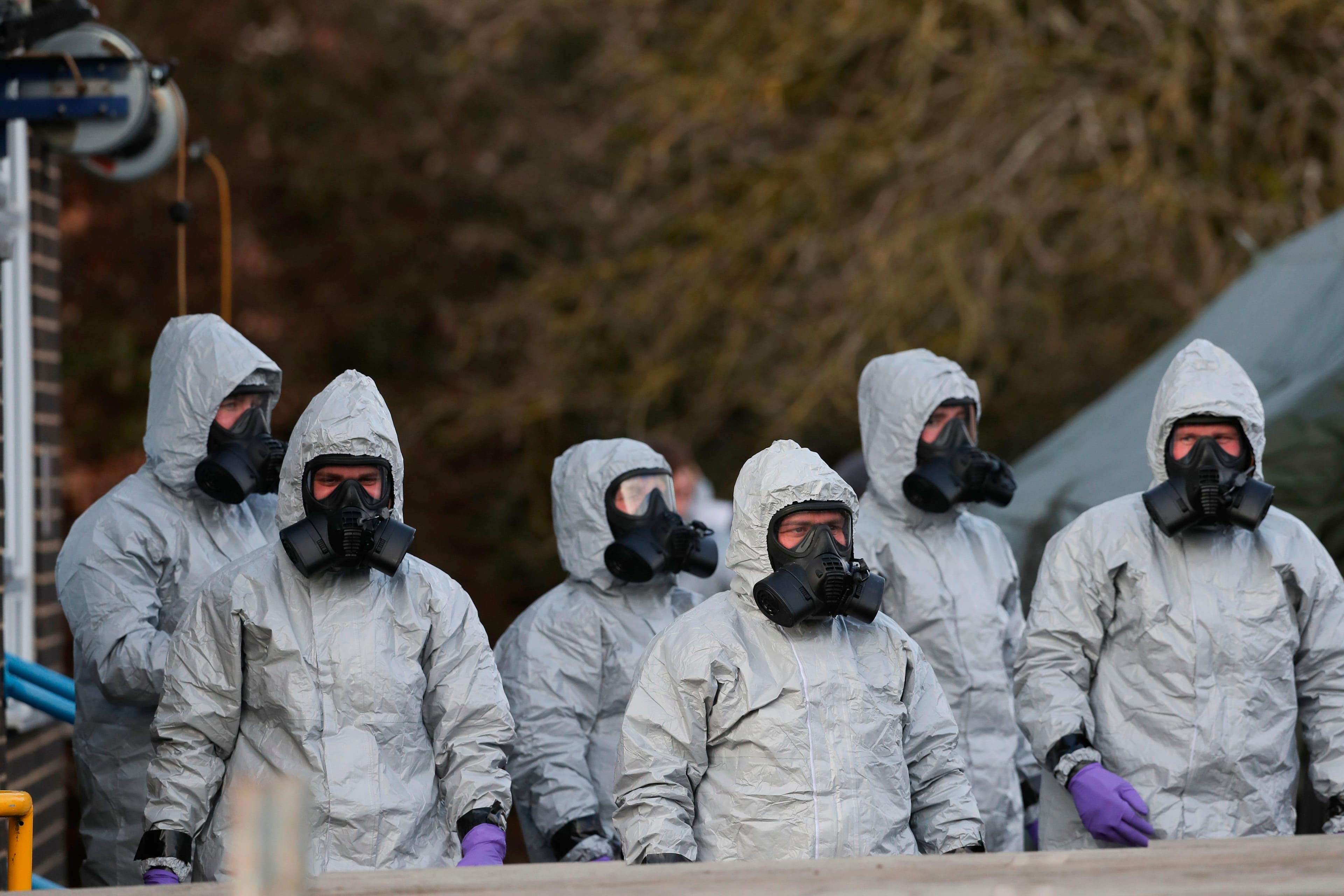 Personnel in protective coveralls and breathing equipment work at the Salisbury District Hospital in Salisbury, southern England, on March 10, 2018, after a man and a woman were poisoned in a nerve agent attack.
(DANIEL LEAL-OLIVAS/AFP/Getty Images)