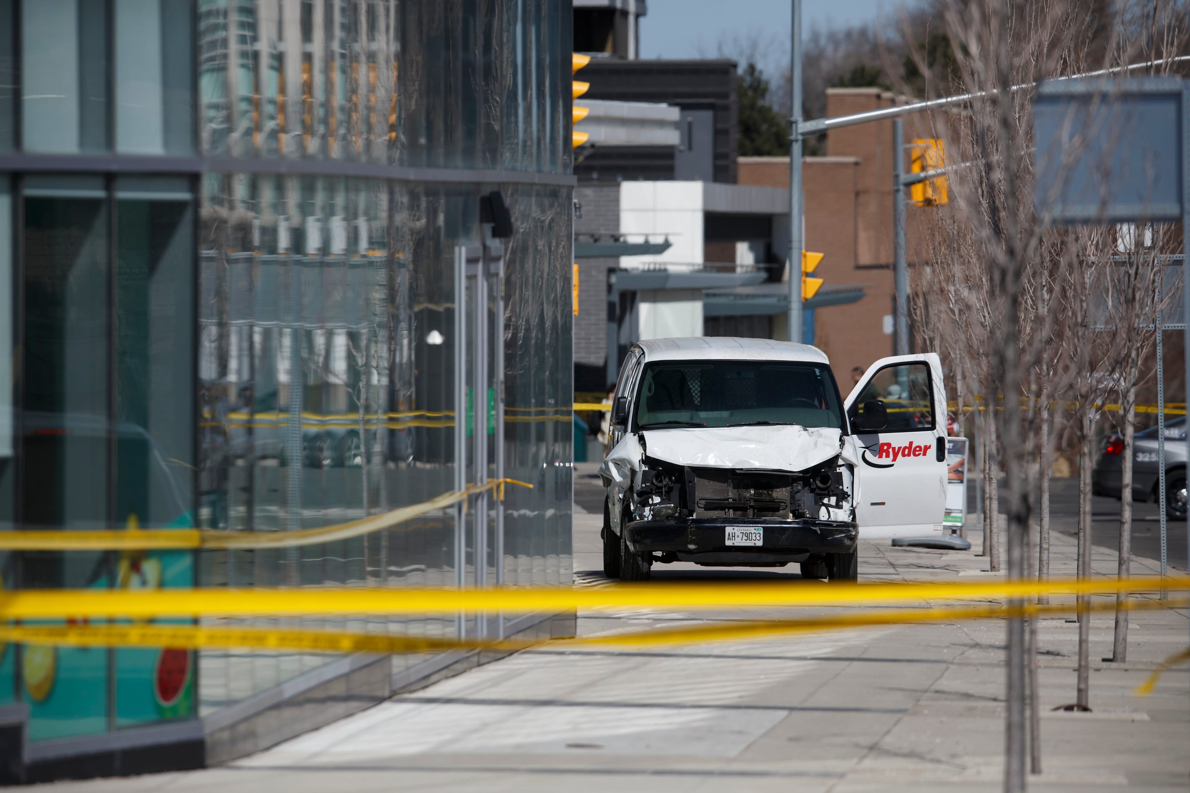Police inspect a van  involved in a collision that killed 10 people at Yonge St. and Finch Ave. on April 23, 2018 in Toronto.
 (Photo by Cole Burston/Getty Images)