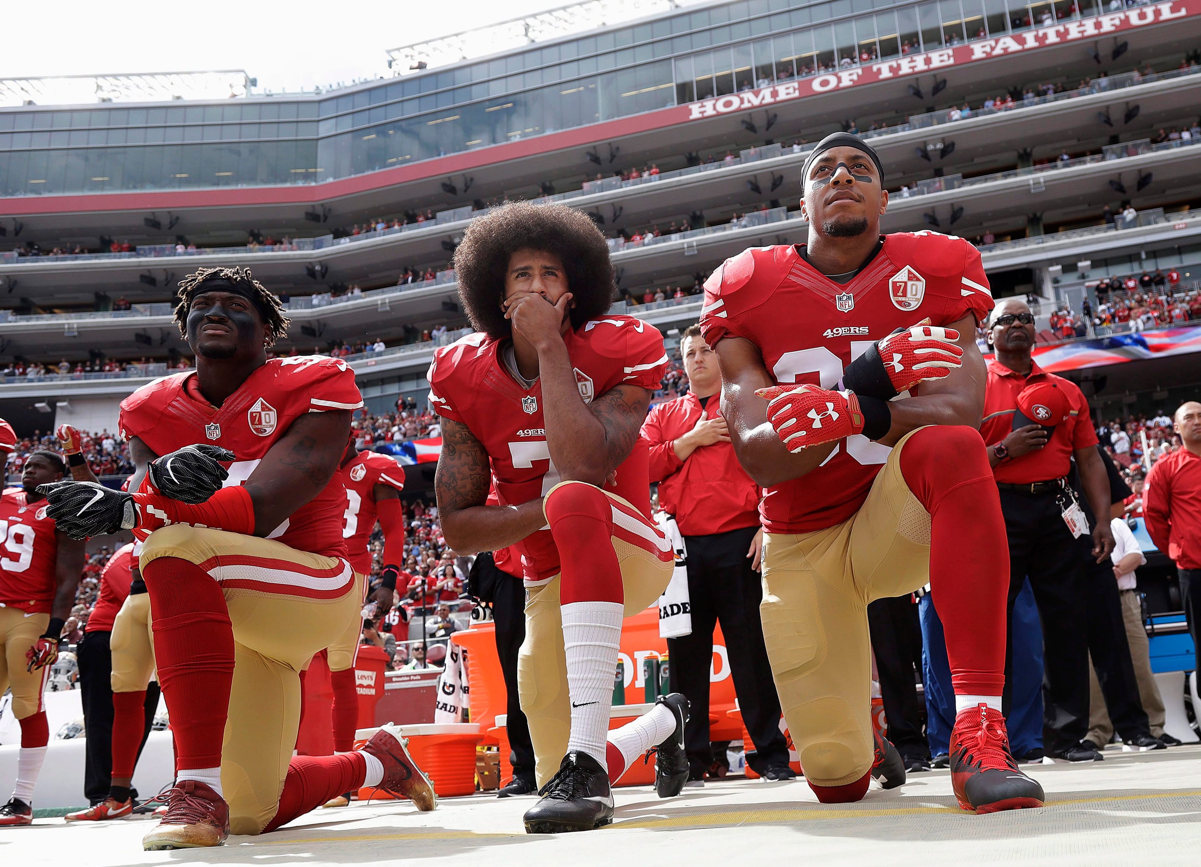 Under the NFL's new policy, players who choose not to stand for the national anthem, like Colin Kaepernic, will force their team to pay a fine. (AP Photo/Marcio Jose Sanchez/File)