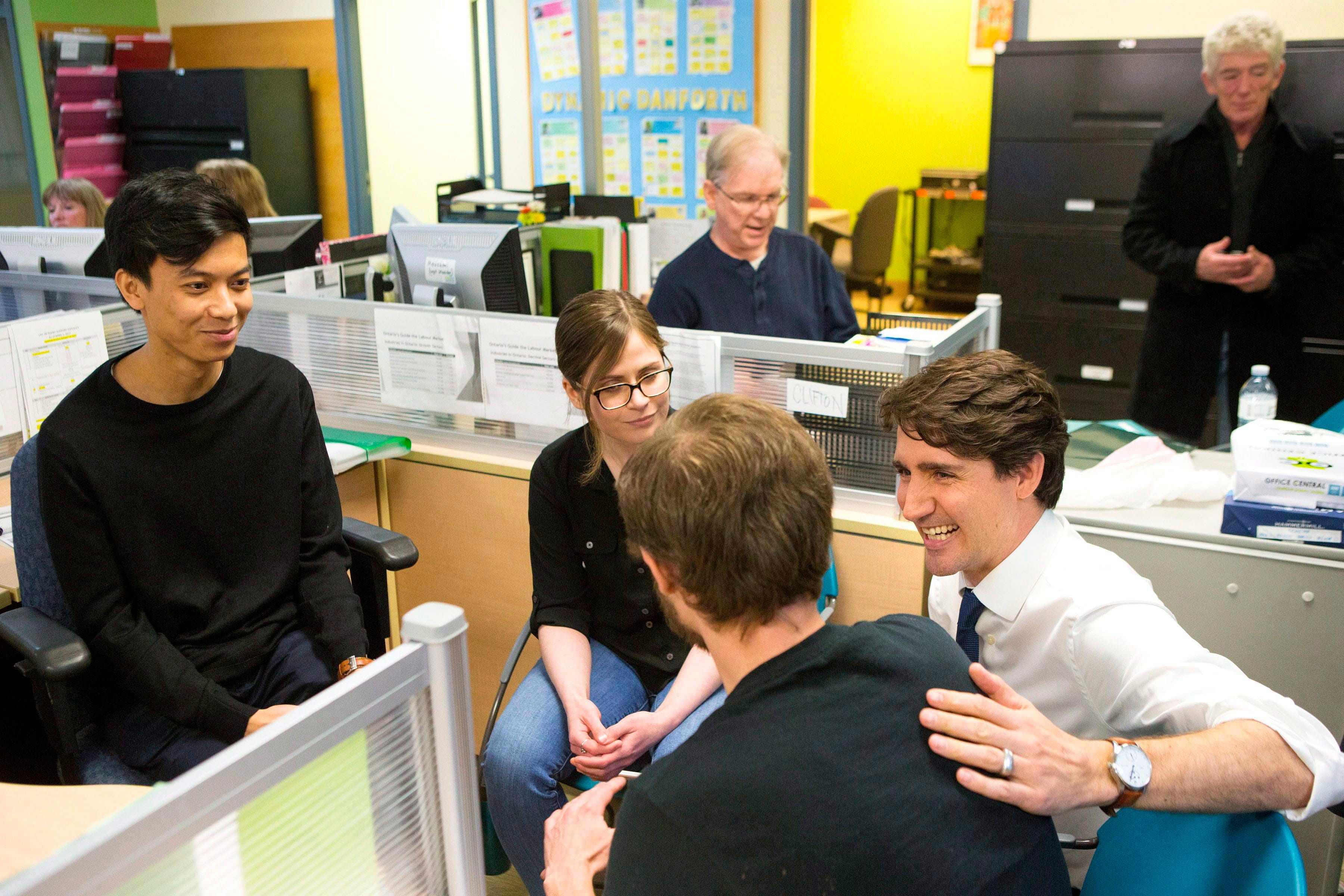 Prime Minister Justin Trudeau talks to clients and staff during a visit to the Employment Services Centre of WoodGreen Community Services in Toronto on Wednesday March 7, 2018. THE CANADIAN PRESS/Chris Young