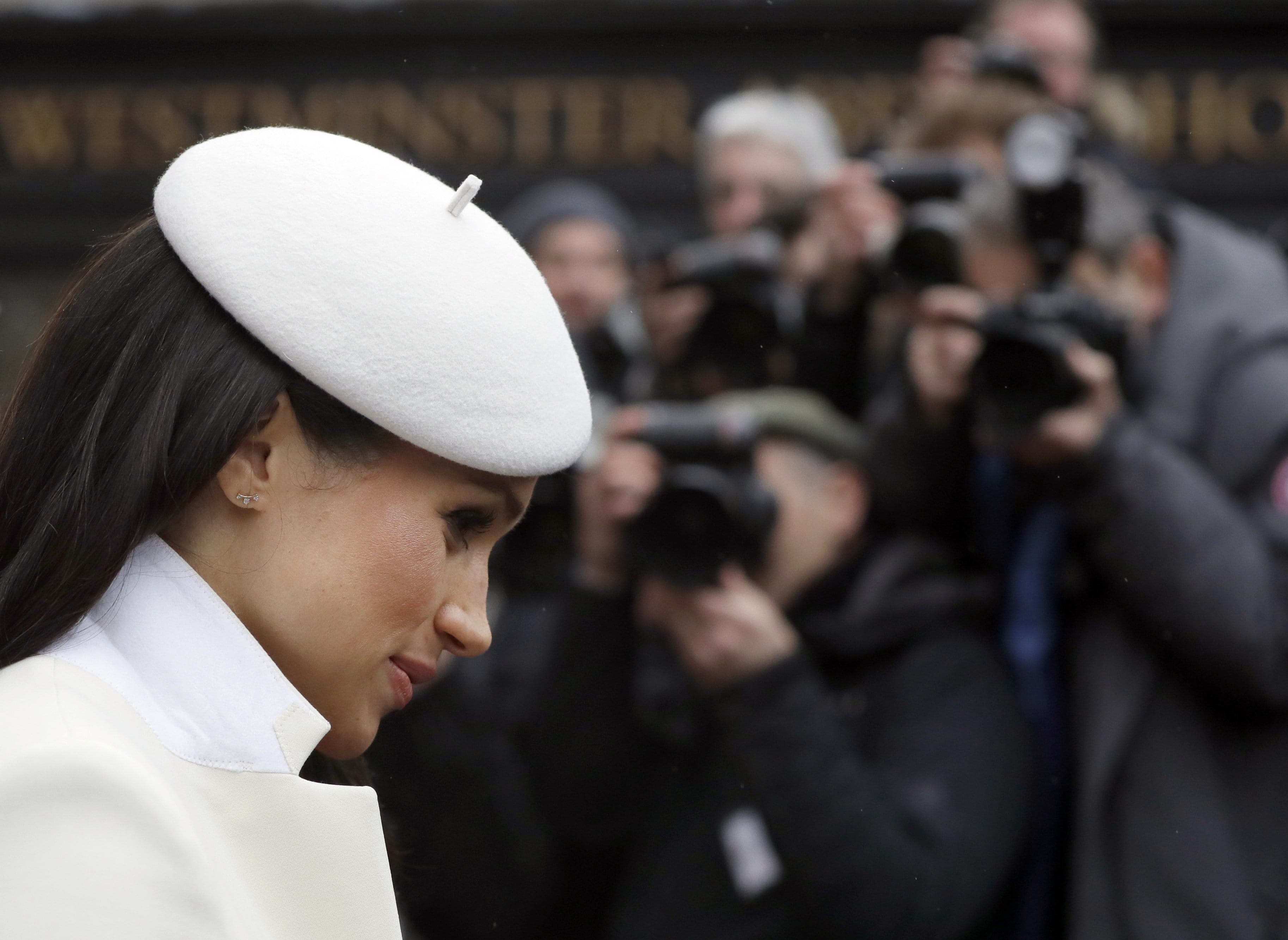 Photographers focus on actress Meghan Markle, fiancee of Britain's Prince Harry, as she leaves a Commonwealth Day Service at Westminster Abbey in central London, on March 12, 2018. (Kirsty Wigglesworth/AFP/Getty Images)