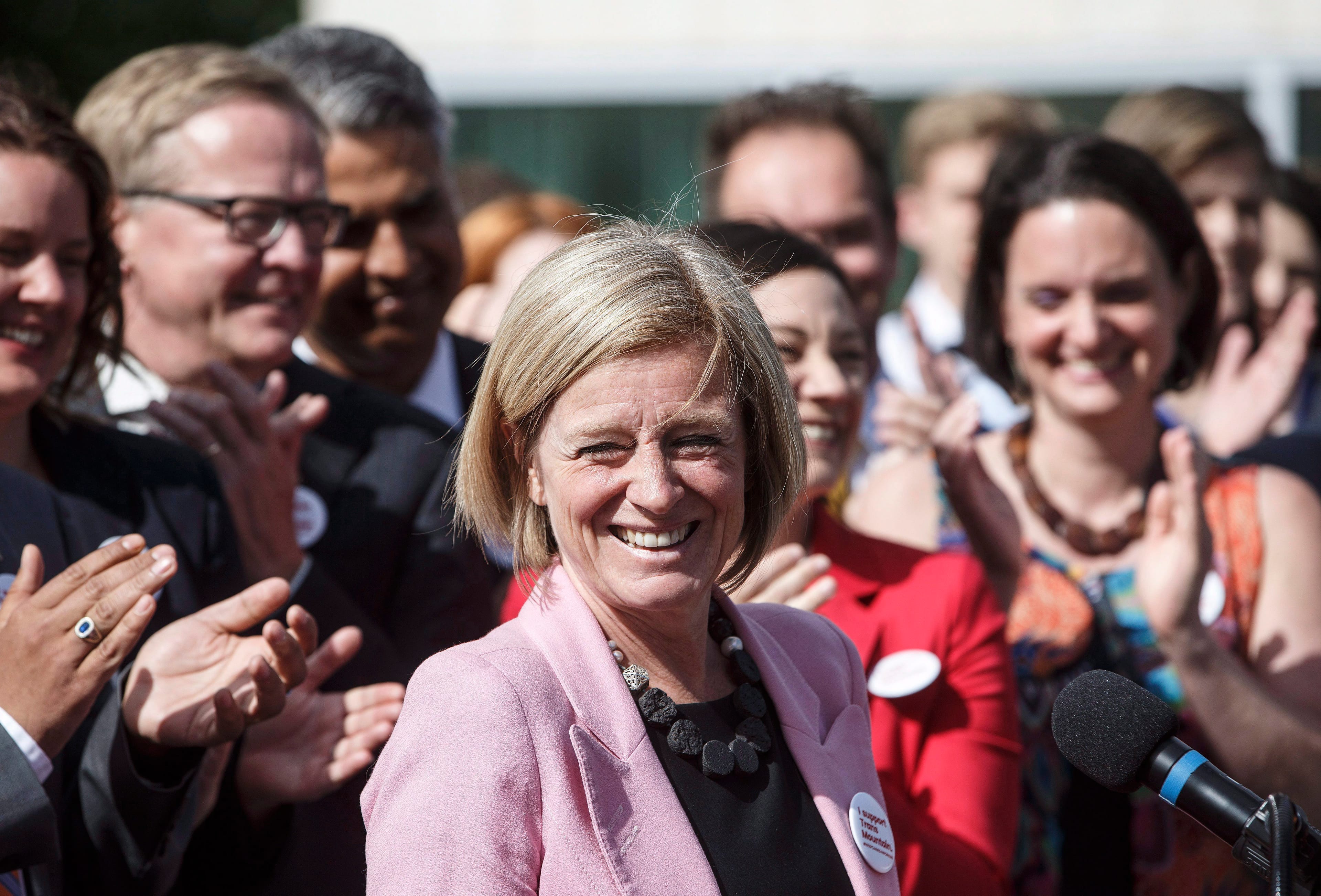 Alberta Premier Rachel Notley is applauded at a press conference after speaking about the Kinder Morgan pipeline project, in Edmonton on Tuesday, May 29, 2018.(Jason Franson/CP)