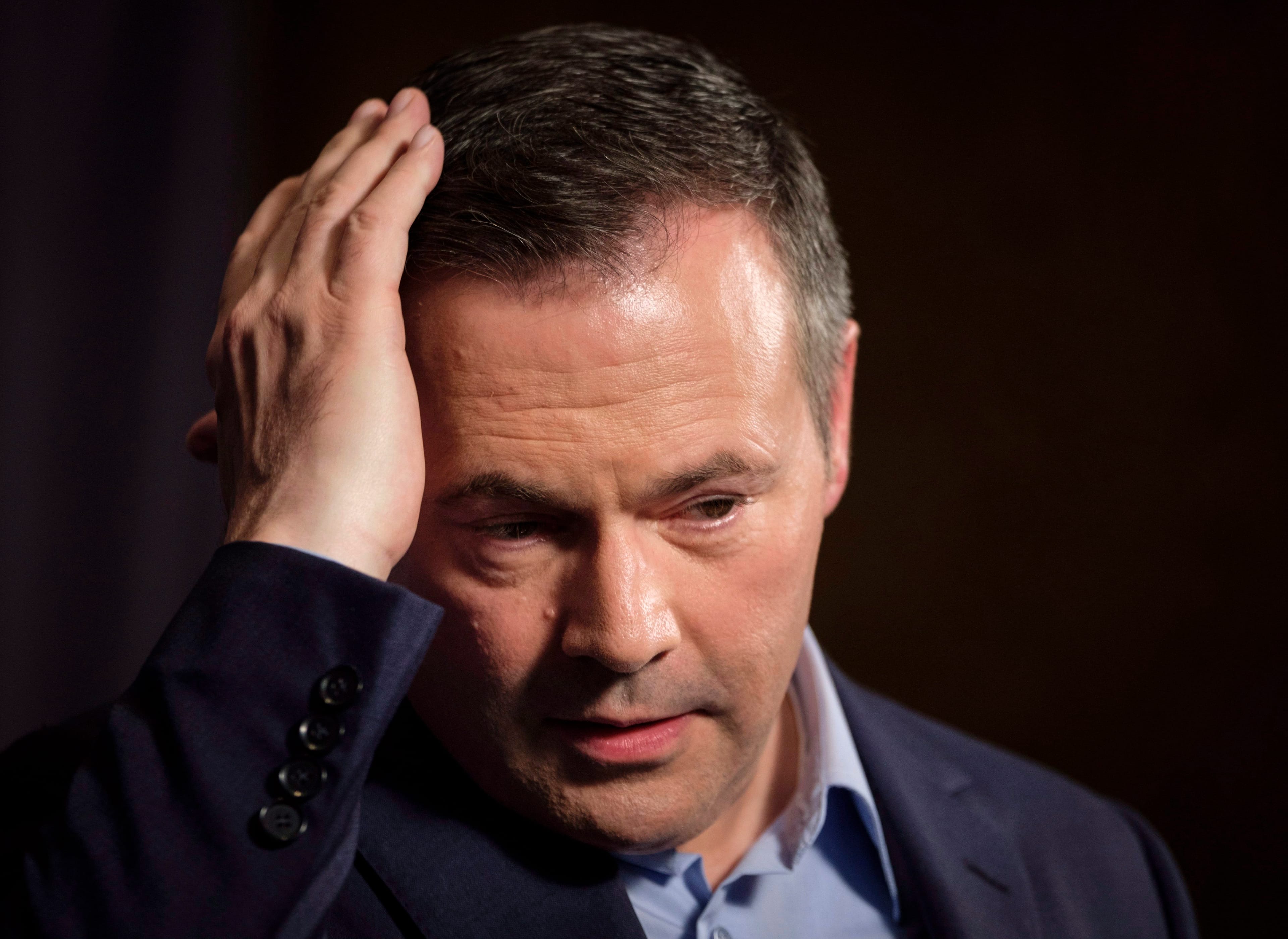 Jason Kenney adjusts his hair as he speaks to the media at his first convention as leader of the United Conservative Party in Red Deer, Alta., Sunday, May 6, 2018.THE CANADIAN PRESS/Jeff McIntosh