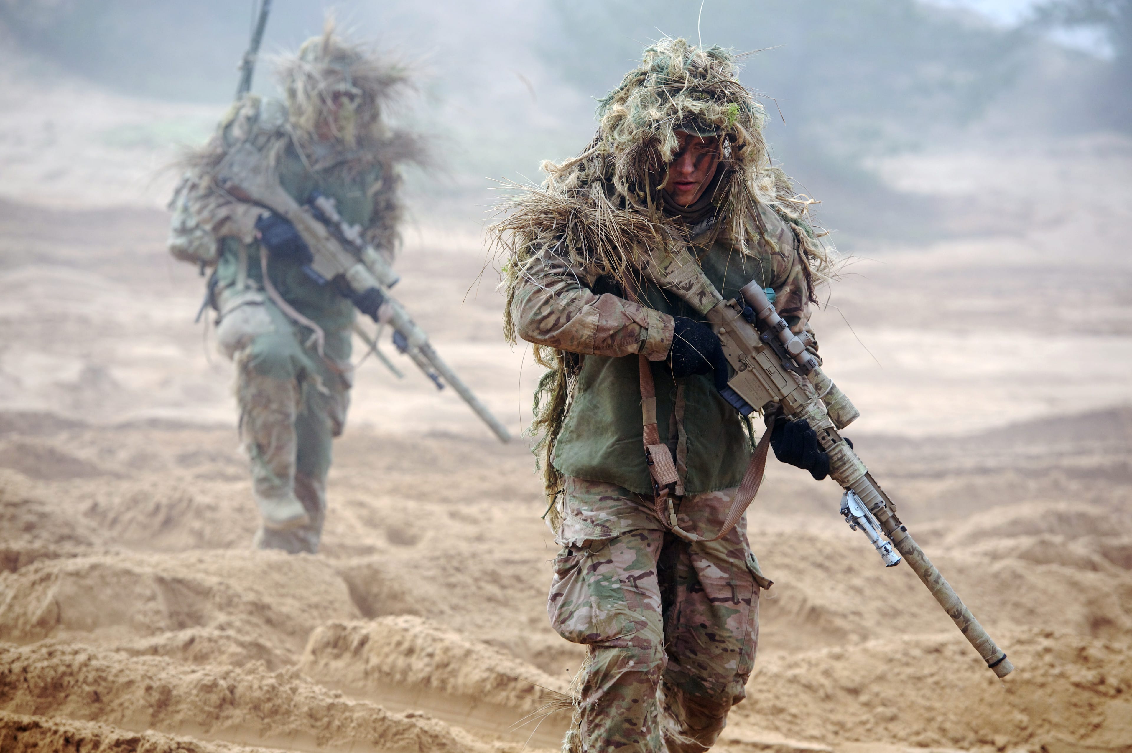 U.S. soldiers train with Latvian and Canadian soldiers at the Adazi military training area in Latvia on Feb. 26, 2015 (ILMARS ZNOTINS/AFP/Getty Images)