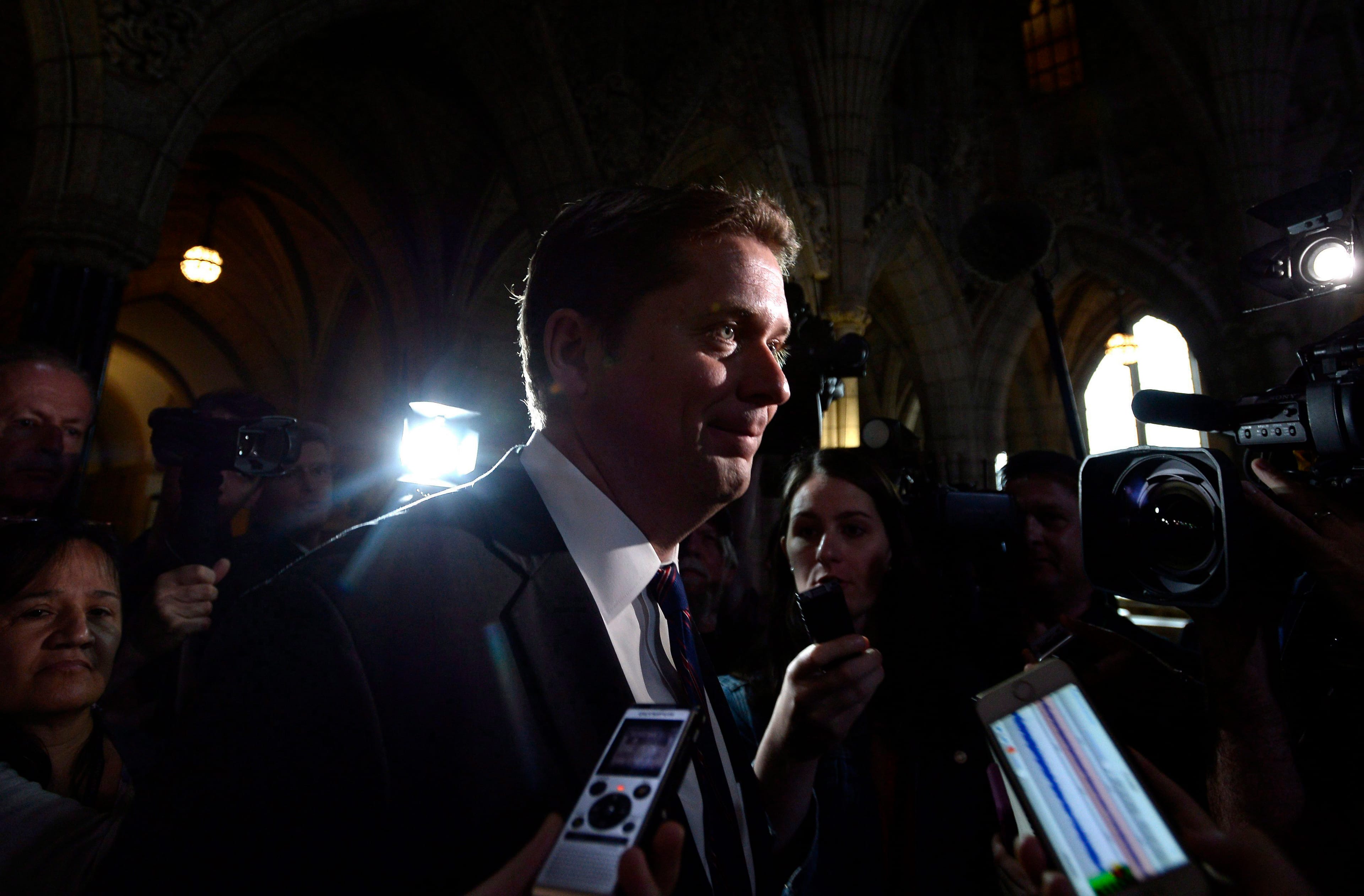 Conservative leader Andrew Scheer makes his way past reporters as he leaves a caucus meeting on Parliament Hill in Ottawa on Wednesday, June 13, 2018. (Justin Tang/CP)