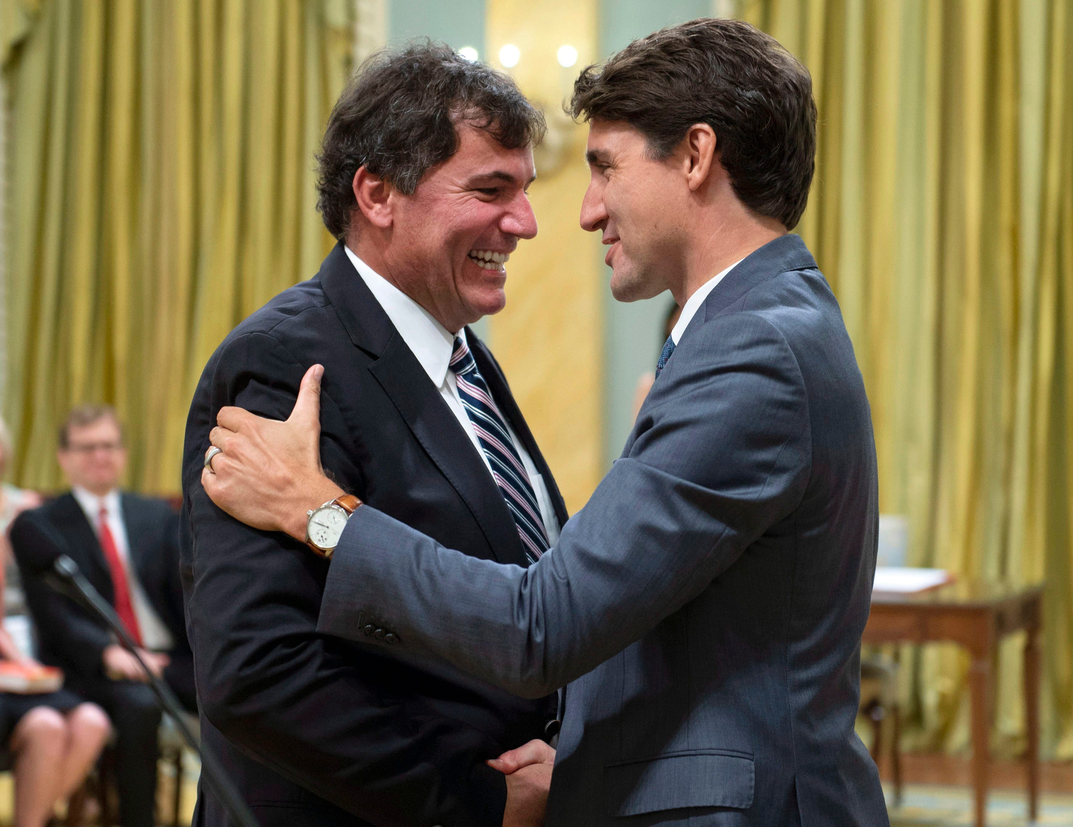 Prime Minister Justin Trudeau shakes hands with Dominic LeBlanc, Minister of Intergovernmental and Northern Affairs and Internal Trade, during a swearing in ceremony at Rideau Hall in Ottawa on Wednesday, July 18, 2018. (THE CANADIAN PRESS/Justin Tang)