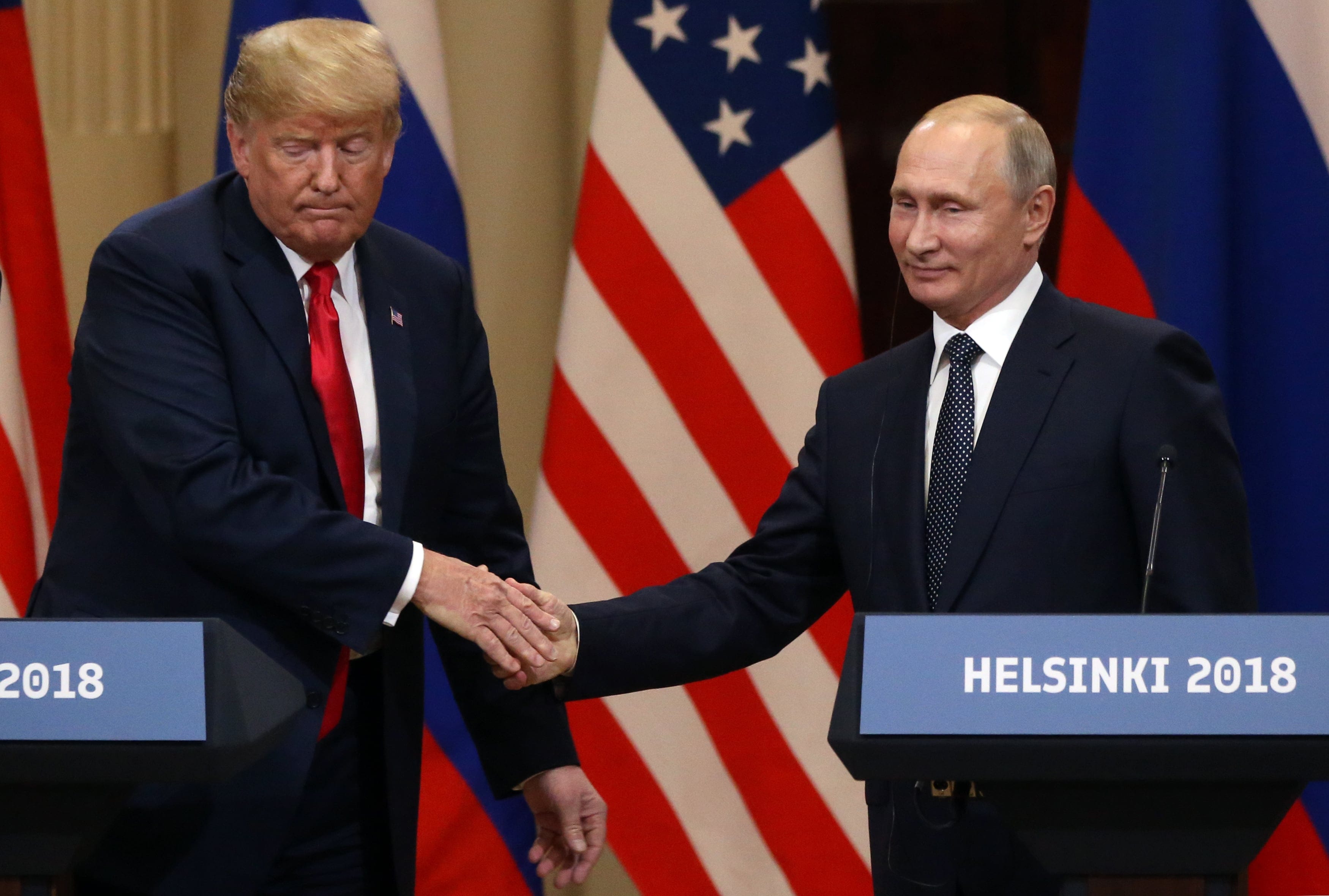 U.S. President Donald Trump and Russian President Vladimir Putin shake hands during a joint press conference after their summit on July 16, 2018 in Helsinki, Finland. (Mikhail Svetlov/Getty Images)
