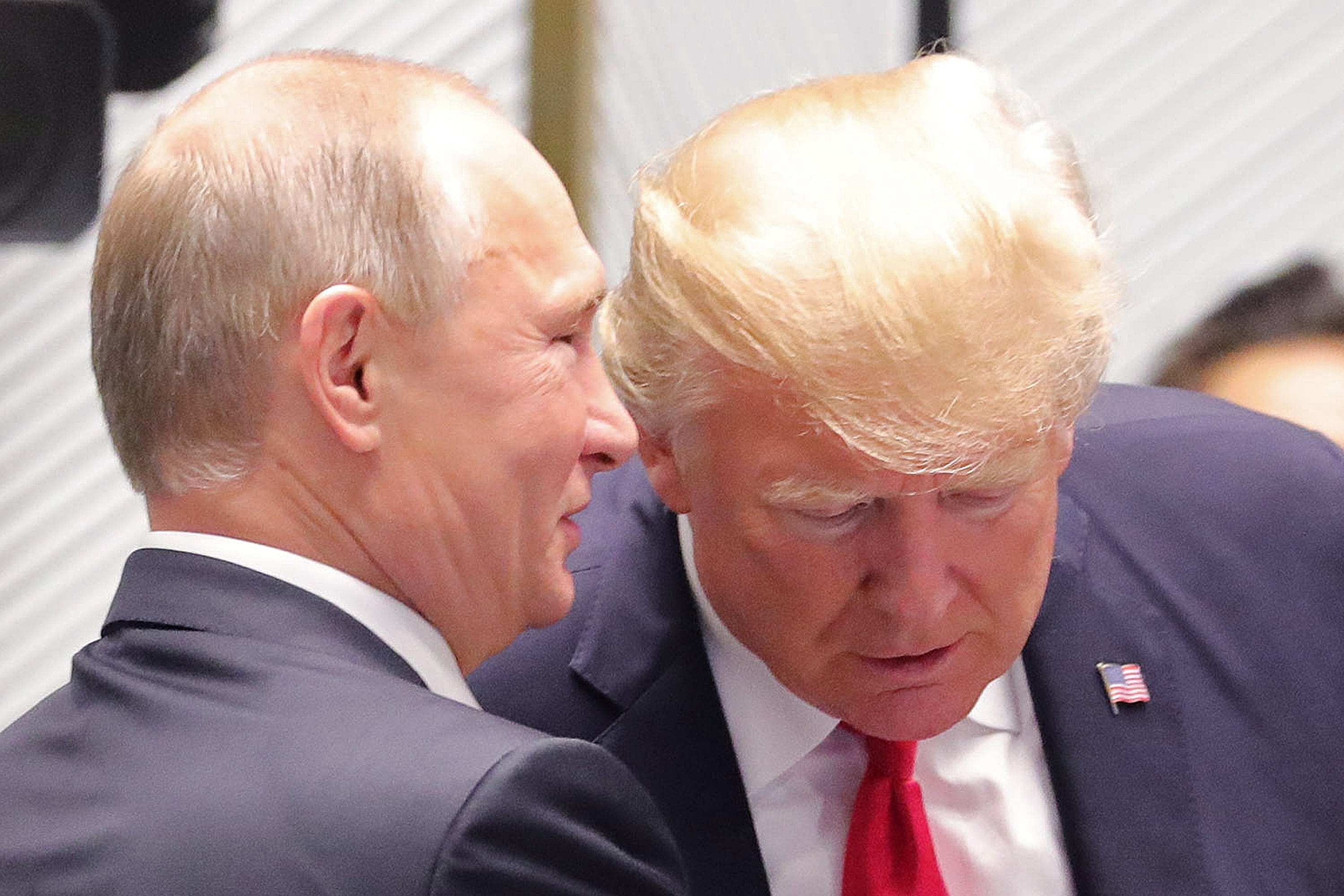 Vladimir Putin and Donald Trump talk on the closing day of the 25th APEC Summit in Da Nang, Vietnam, on Nov. 11, 2017. (Mikhail Klimentyev TASS via Getty Images)