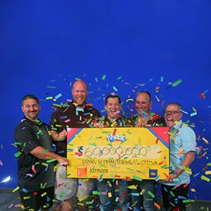 From left to right, Gilles Dionne, Stephane Dionne, , Bryan Redman, Christopher Beazley, and Norman MacDonald receving their $60-million cheque at the OLG prize centre in Toronto on July 19, 2018. (OLG)