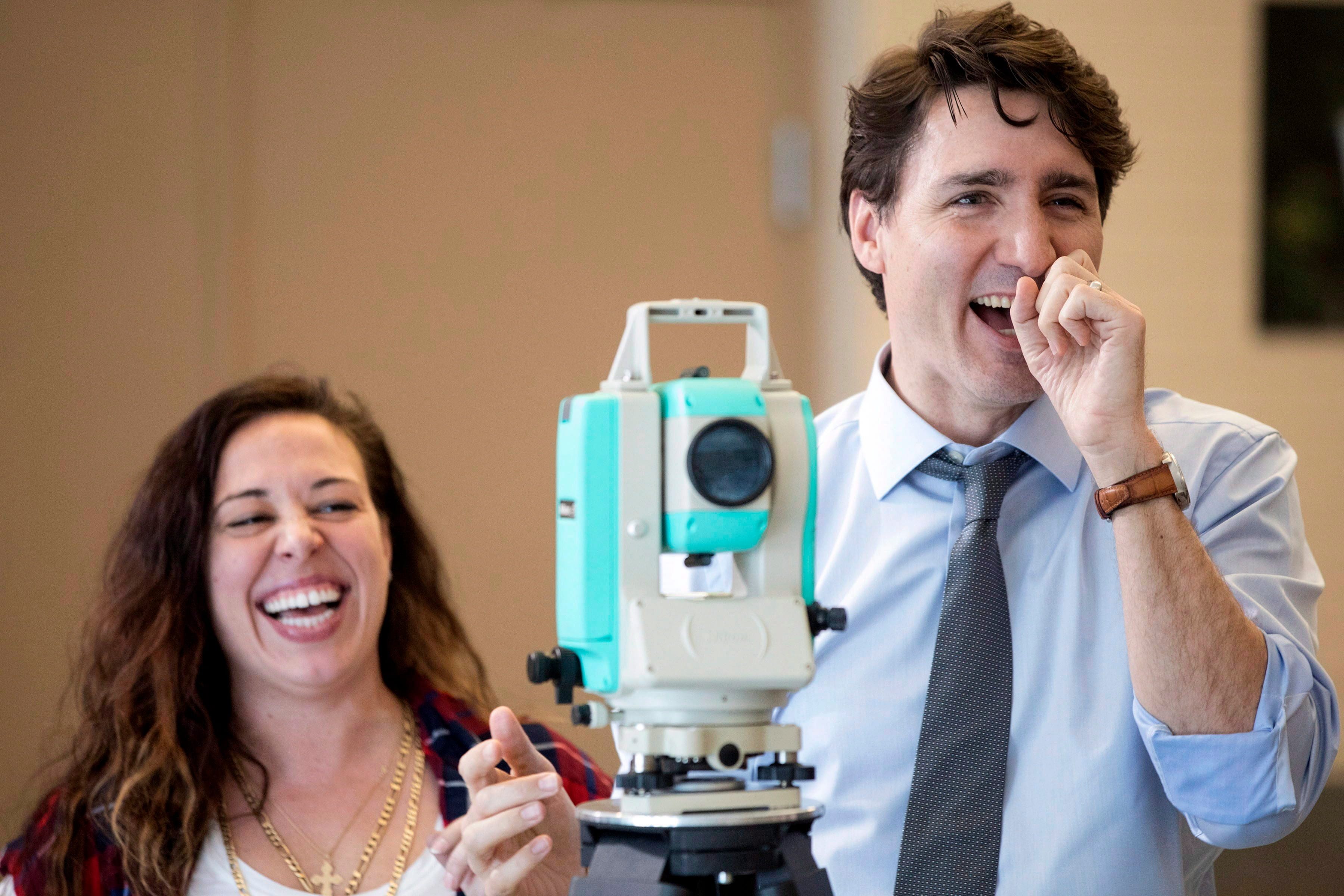 Prime Minister Justin Trudeau shares a joke with a student during a visit to Georgian College in Barrie, Ont., on Friday, March 2, 2018. Trudeau spoke to students on the subject of Budget 2018's Pay Equity policy. (THE CANADIAN PRESS/Chris Young)