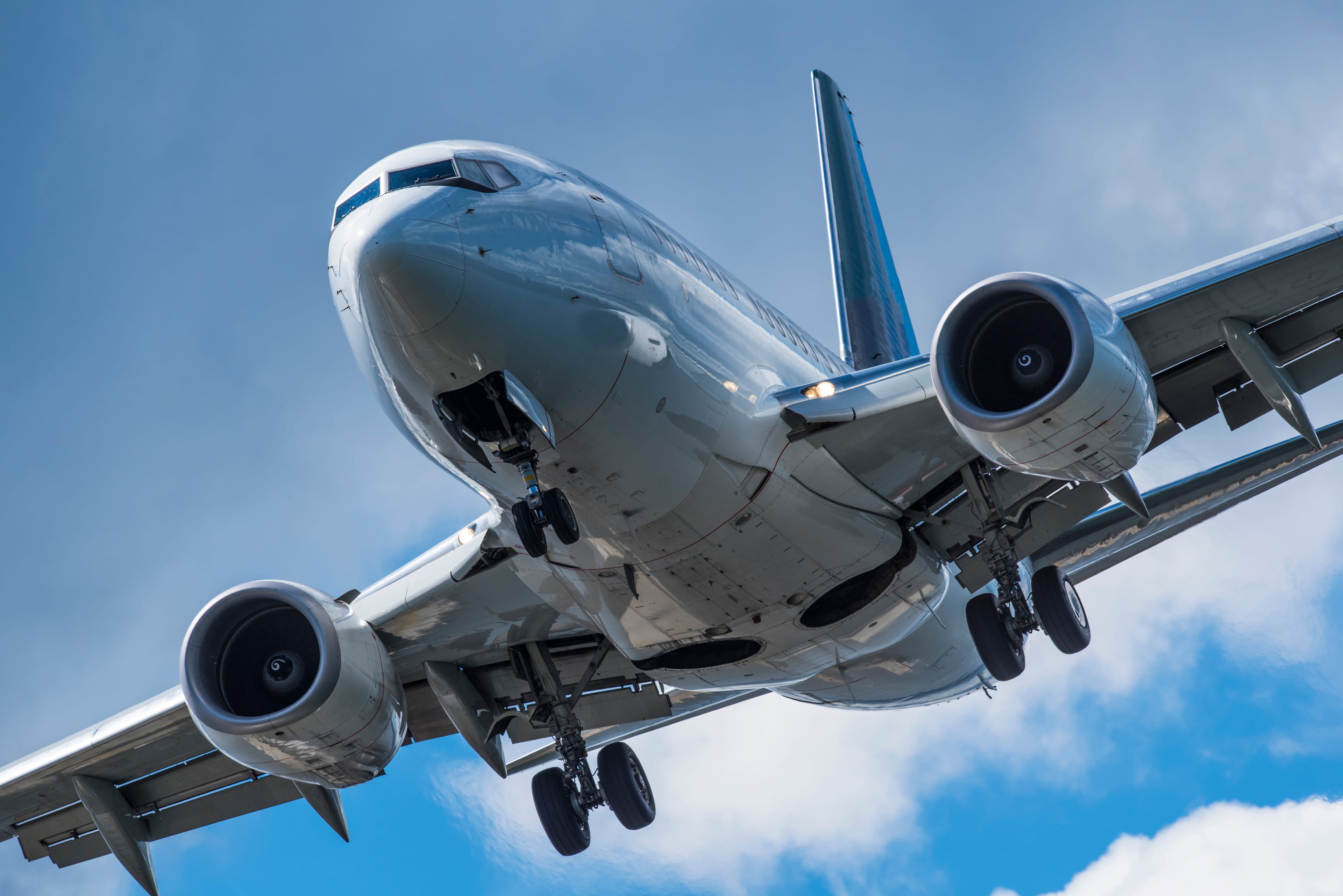 A telephoto image of a plane landing at an airport in British Columbia. (Shutterstock)