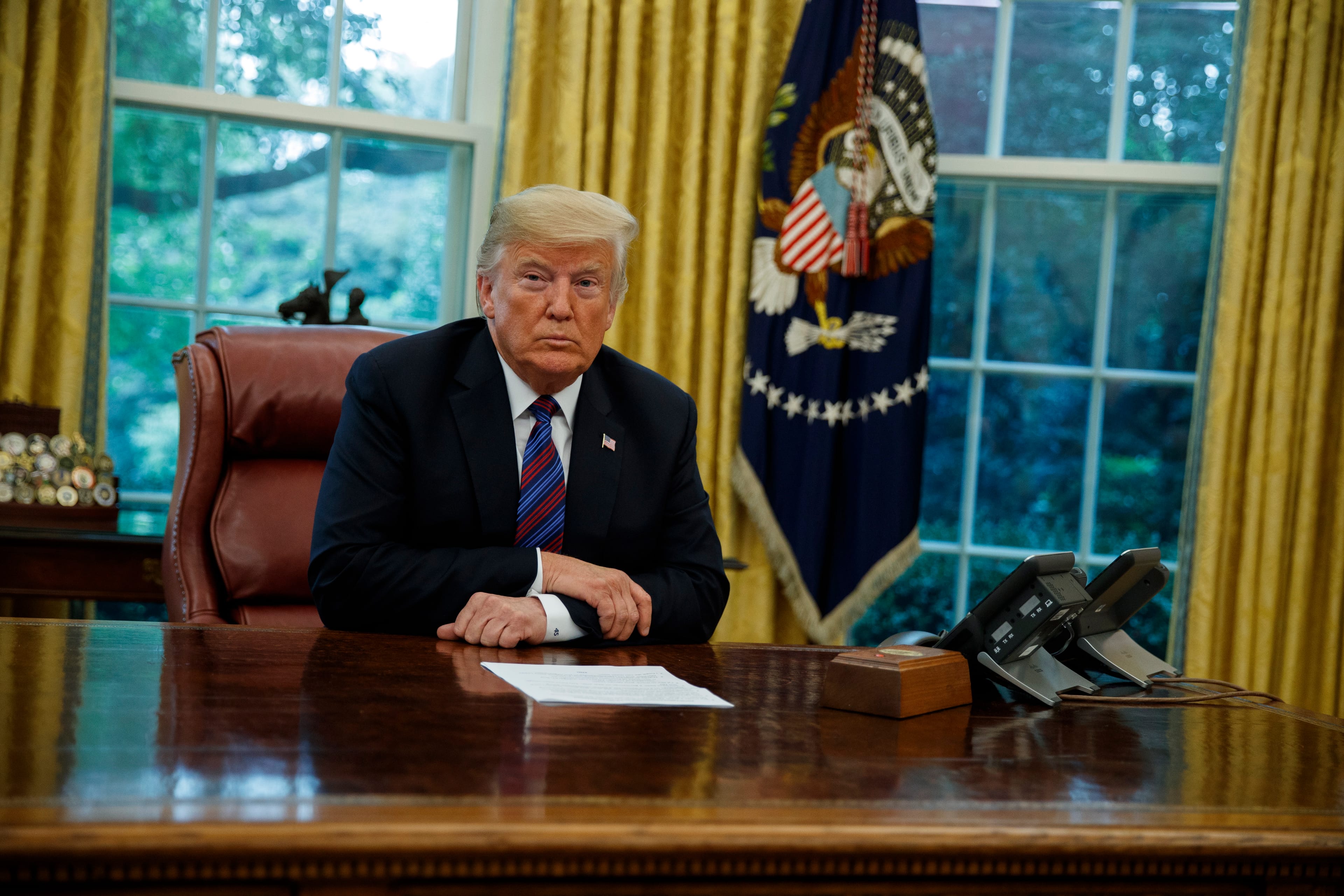 President Donald Trump listens during a phone call with Mexican President Enrique Pena Nieto about a trade agreement between the United States and Mexico, in the Oval Office of the White House, Monday, Aug. 27, 2018, in Washington. (AP Photo/Evan Vucci)