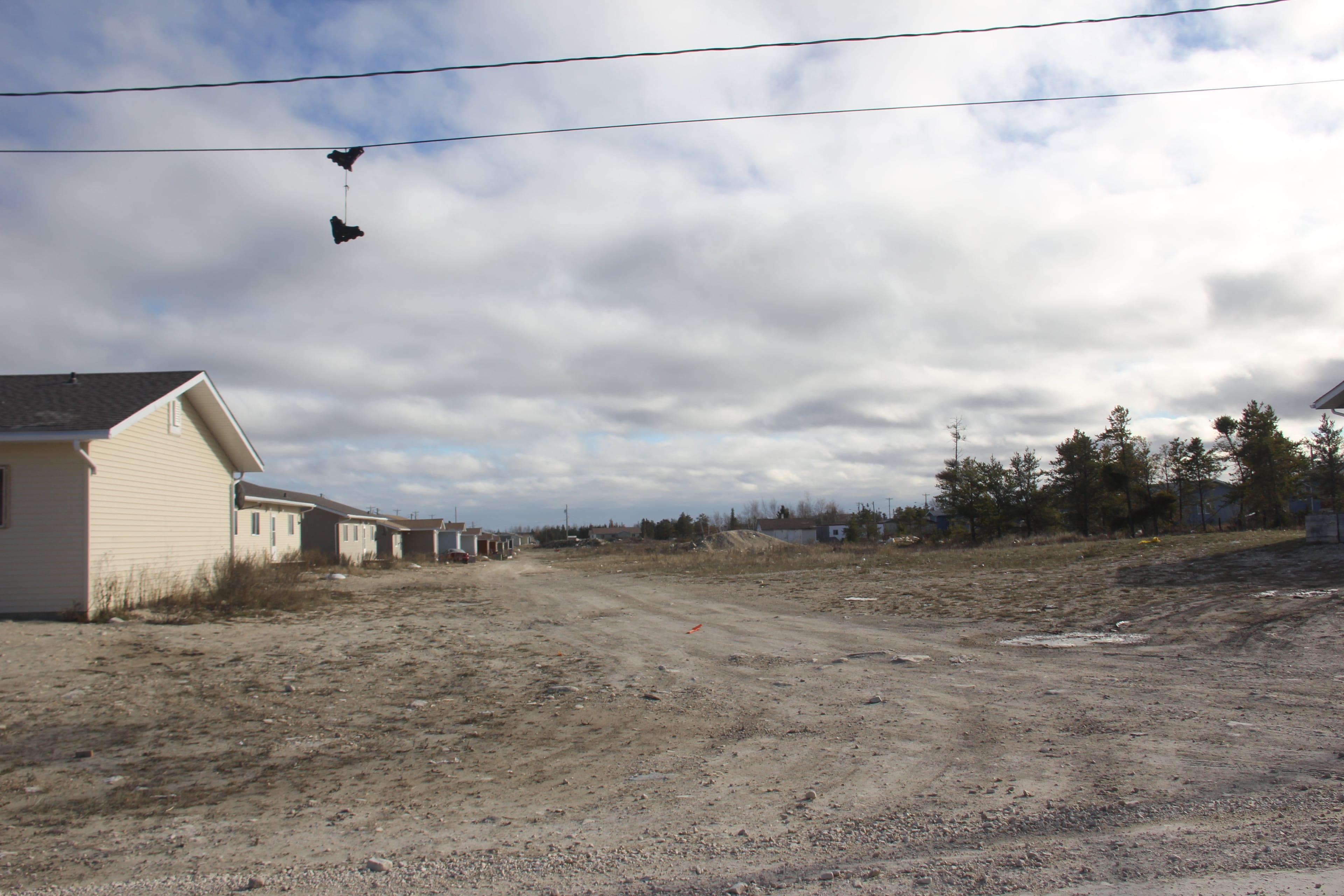 A pair of rollerblades hang from a telephone wire in Easterville, a First Nations reserve in northern Manitoba. (Brendan Kennedy/Toronto Star via Getty Images)