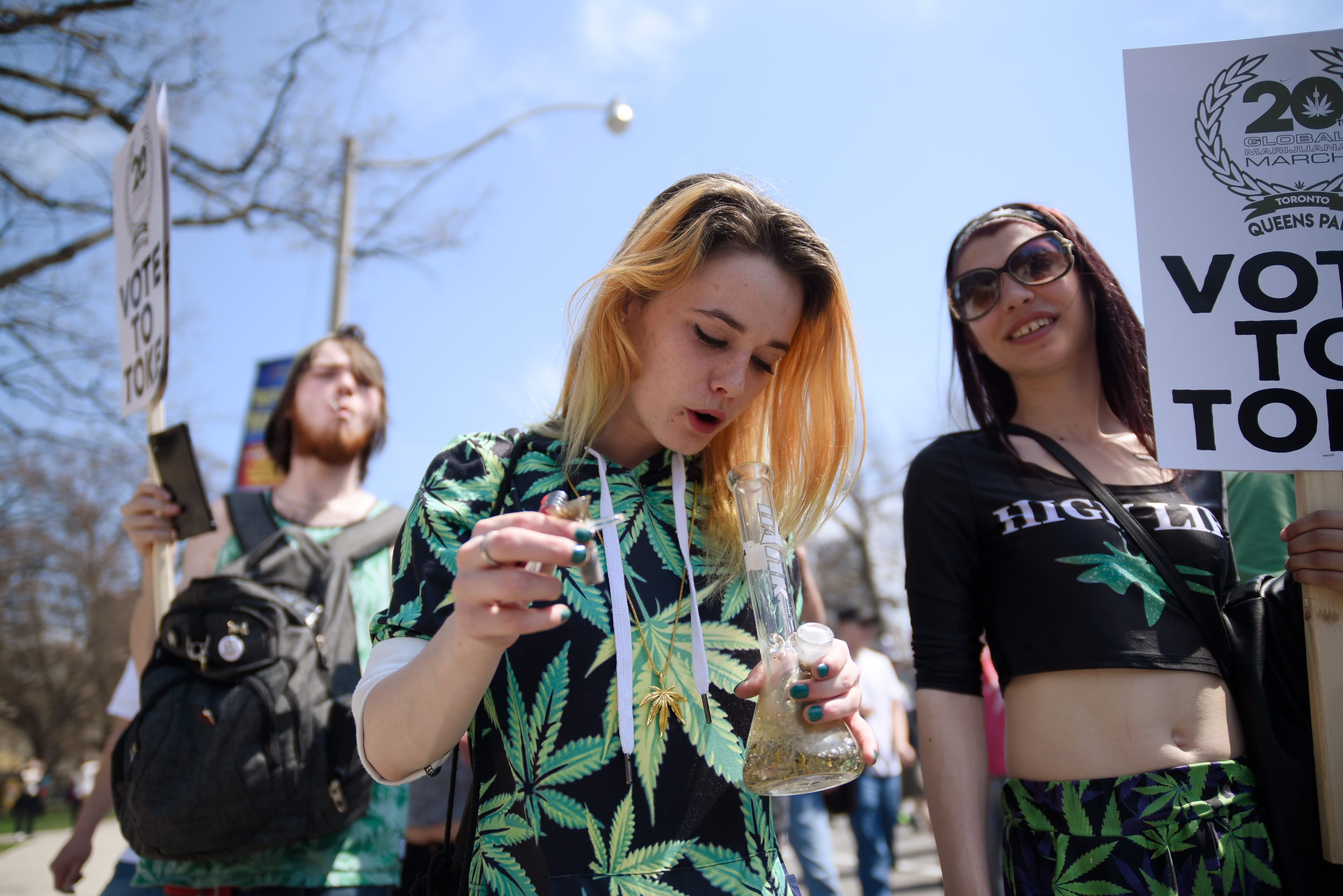 Teens smoking up Marijuana with a bong during the Toronto Global Marijuana march 2018, just a few months before Canada legalizes Marijuana in Toronto, Canada, on May 5, 2018. (Photo by Arindam Shivaani/NurPhoto via Getty Images)