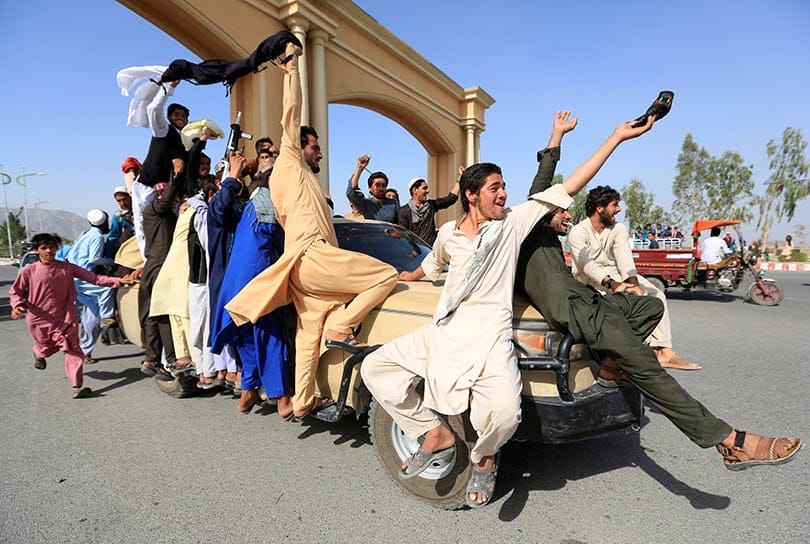 People celebrate ceasefire in Rodat district of Nangarhar province, Afghanistan June 16, 2018. (Parwiz Parwiz/Reuters)