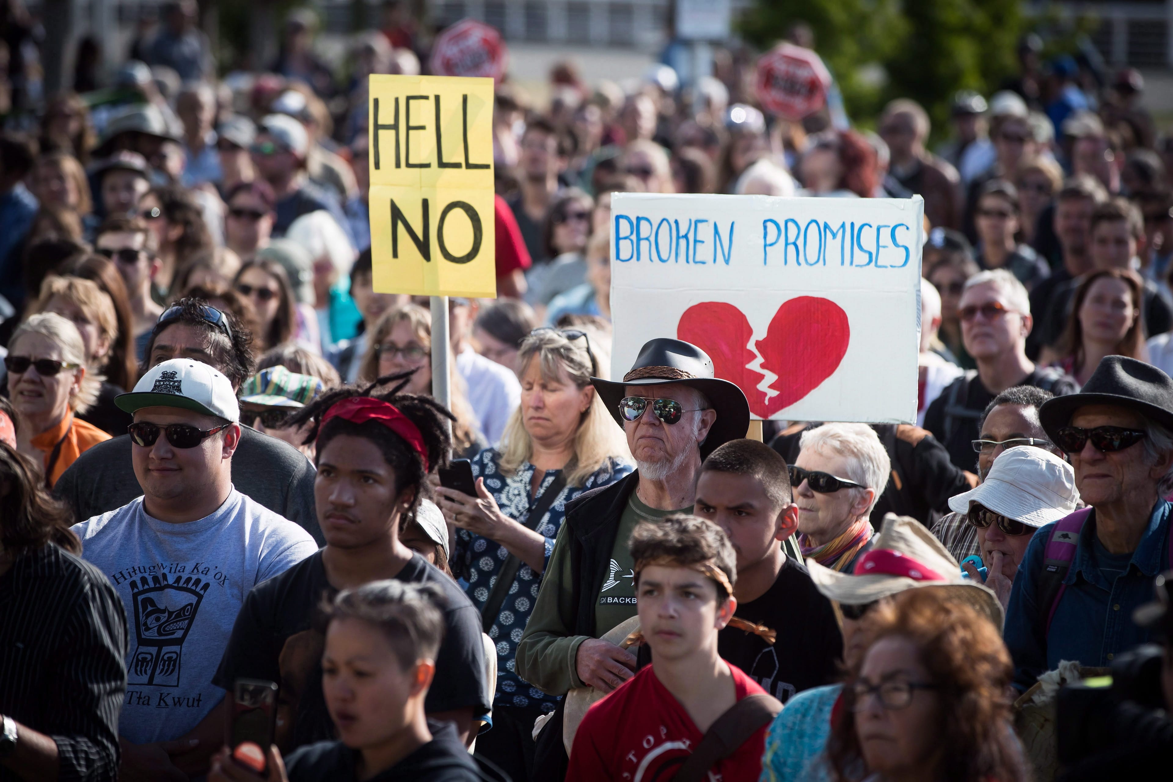 People listen during a protest against the Kinder Morgan Trans Mountain Pipeline expansion, in Vancouver, on Tuesday May 29, 2018. The federal Liberal government is spending $4.5 billion to buy Trans Mountain and all of Kinder Morgan Canada's core assets, Finance Minister Bill Morneau said Tuesday as he unveiled the government's long-awaited, big-budget strategy to save the plan to expand the oilsands pipeline. THE CANADIAN PRESS/Darryl Dyck