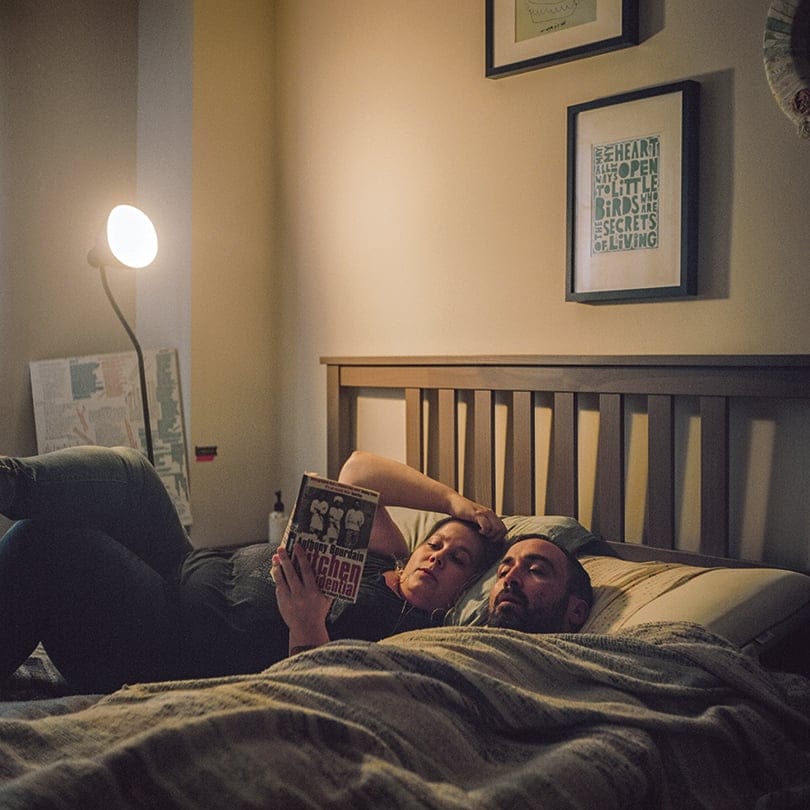 Robin Giles reads to her 41-year-old husband Jo Aubin, who has Alzheimer's. (Chris Donovan)