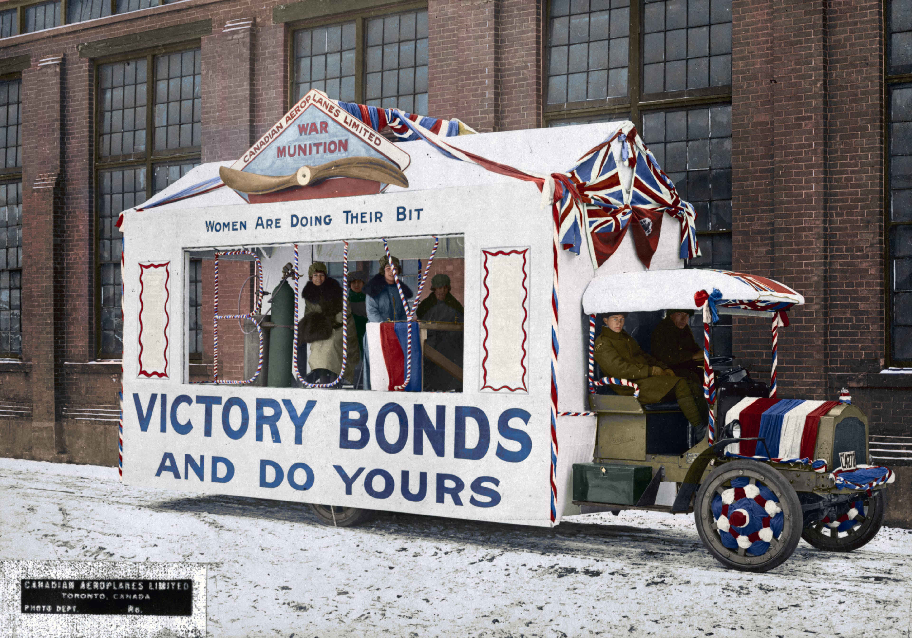 This photo of a Canadian Aeroplane Victory Loan Float c. 1917 is one of the images in the Vimy Foundation’s 'They Fought in Colour,' a new book that collects 260 digitally colourized photographs showcasing Canada’s contribution to the First World War. (John Boyd, PA-025181/Library and Archives Canada/Vimy Foundation)