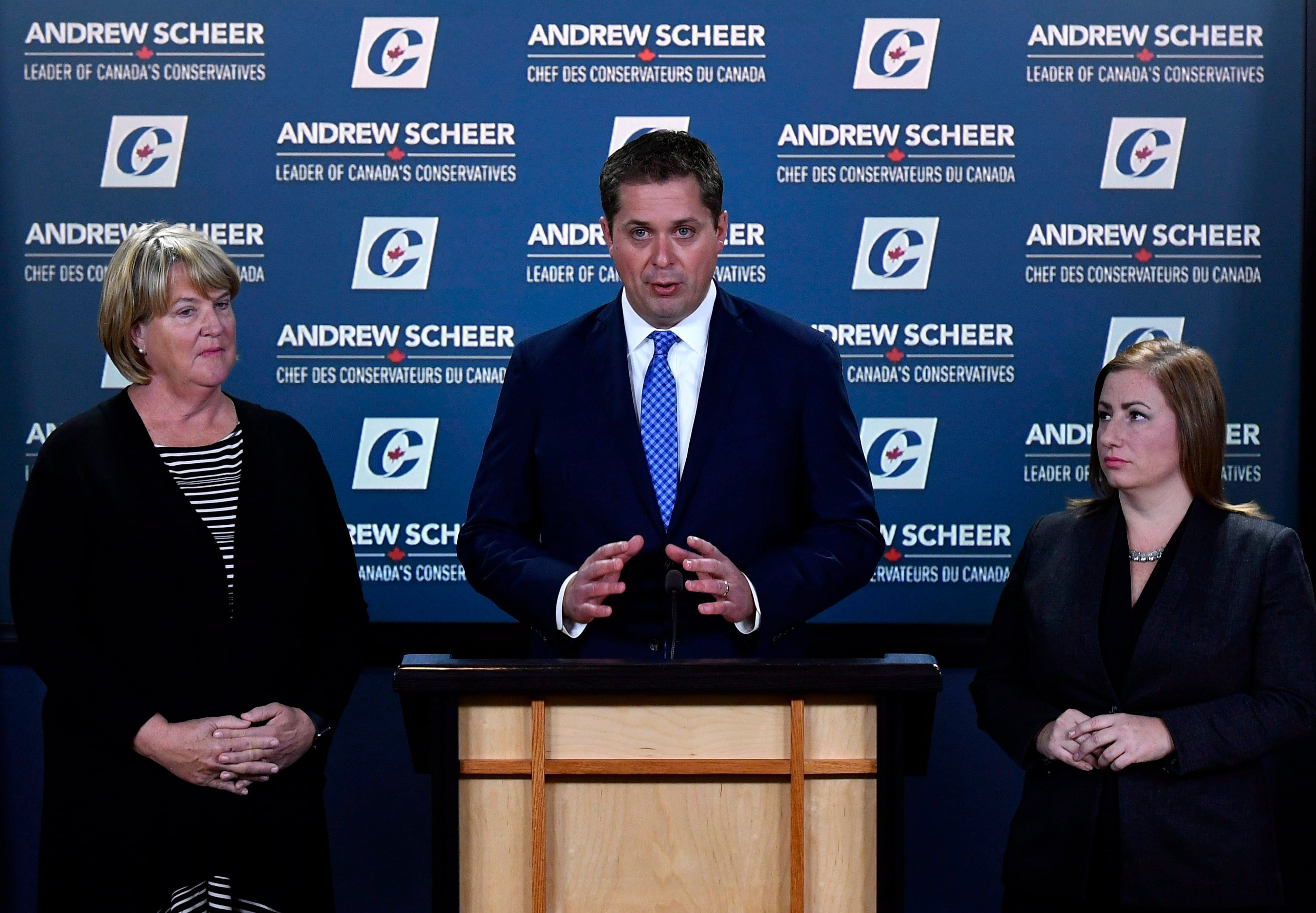Conservative leader Andrew Scheer speaks during a press conference on his plan to get the Trans Mountain Pipeline built, as MPs Cathy McLeod, left, and Shannon Stubbs look on, in Ottawa on Monday, Sept. 24, 2018. (THE CANADIAN PRESS/Justin Tang)