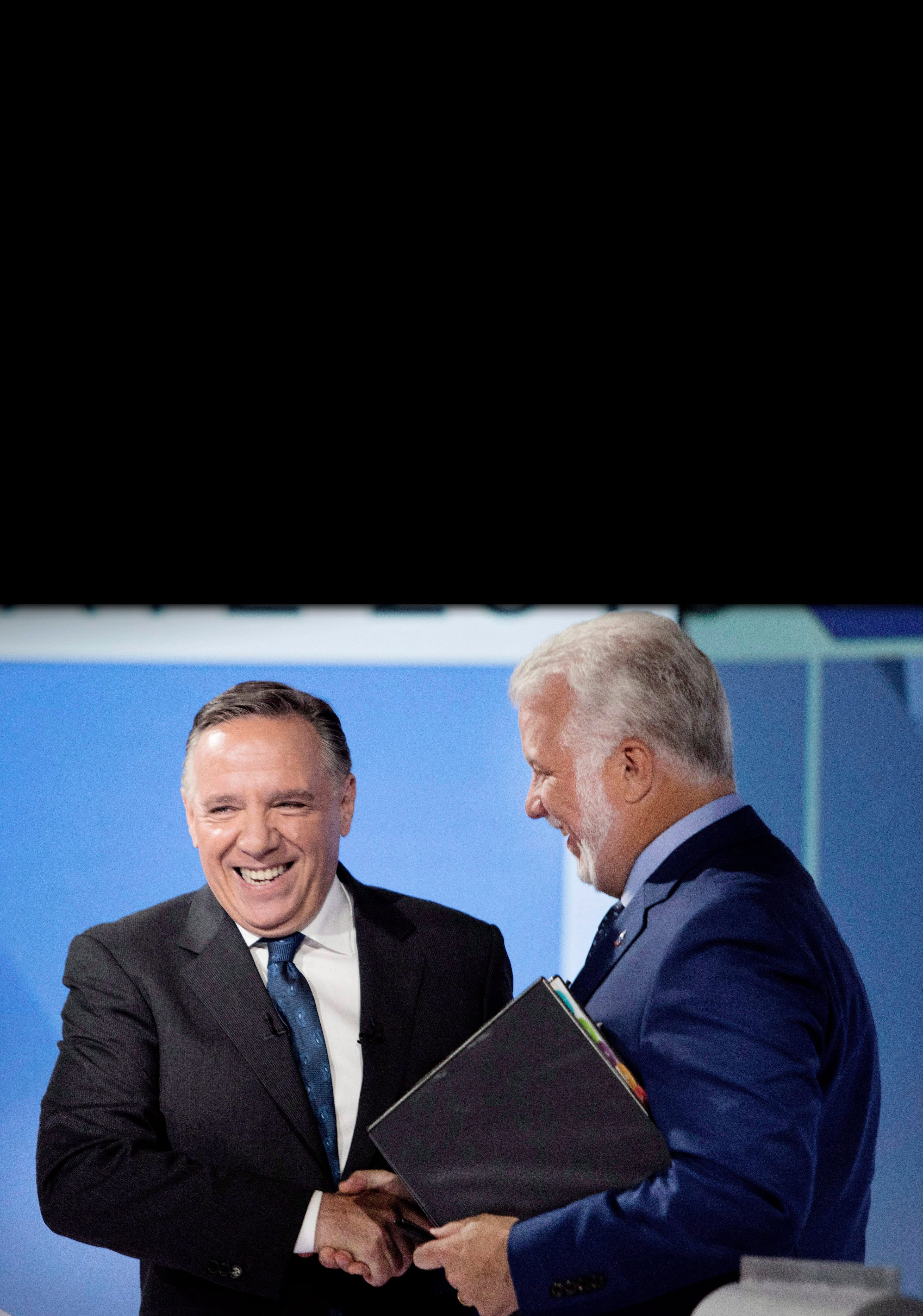CAQ leader Francois Legault, left, shakes hands with Liberal Leader Philippe Couillard after their English language debate,  Monday, September 17, 2018 in Montreal, Que. (Allan McInnis/CP)