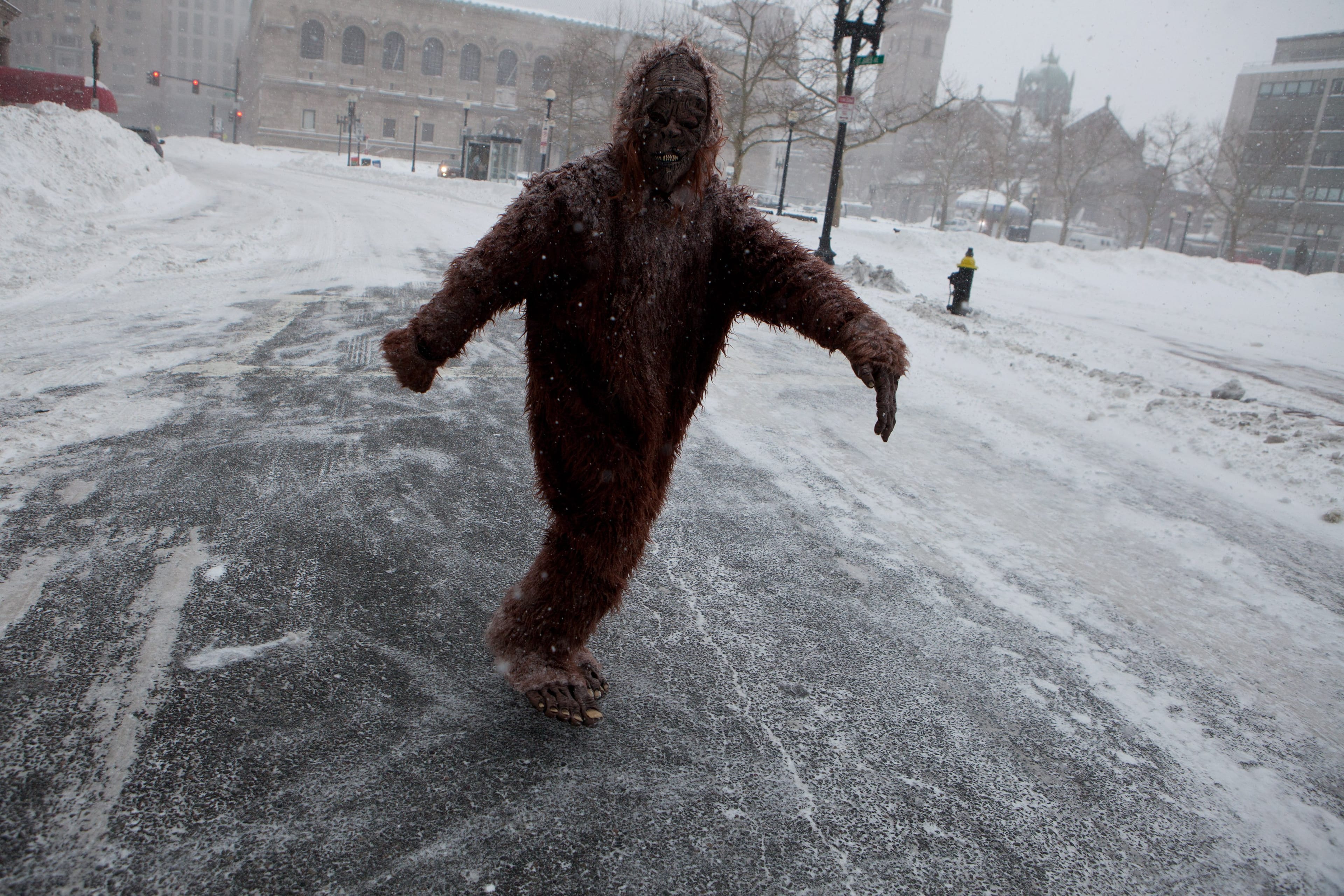 A pedestrian dressed as 'Bigfoot' makes their way through the strong wind and snow in the Back Bay neighbourhood during a blizzard on January 27, 2015 in Boston, Massachusetts. (Kayana Szymczak/Getty Images)
