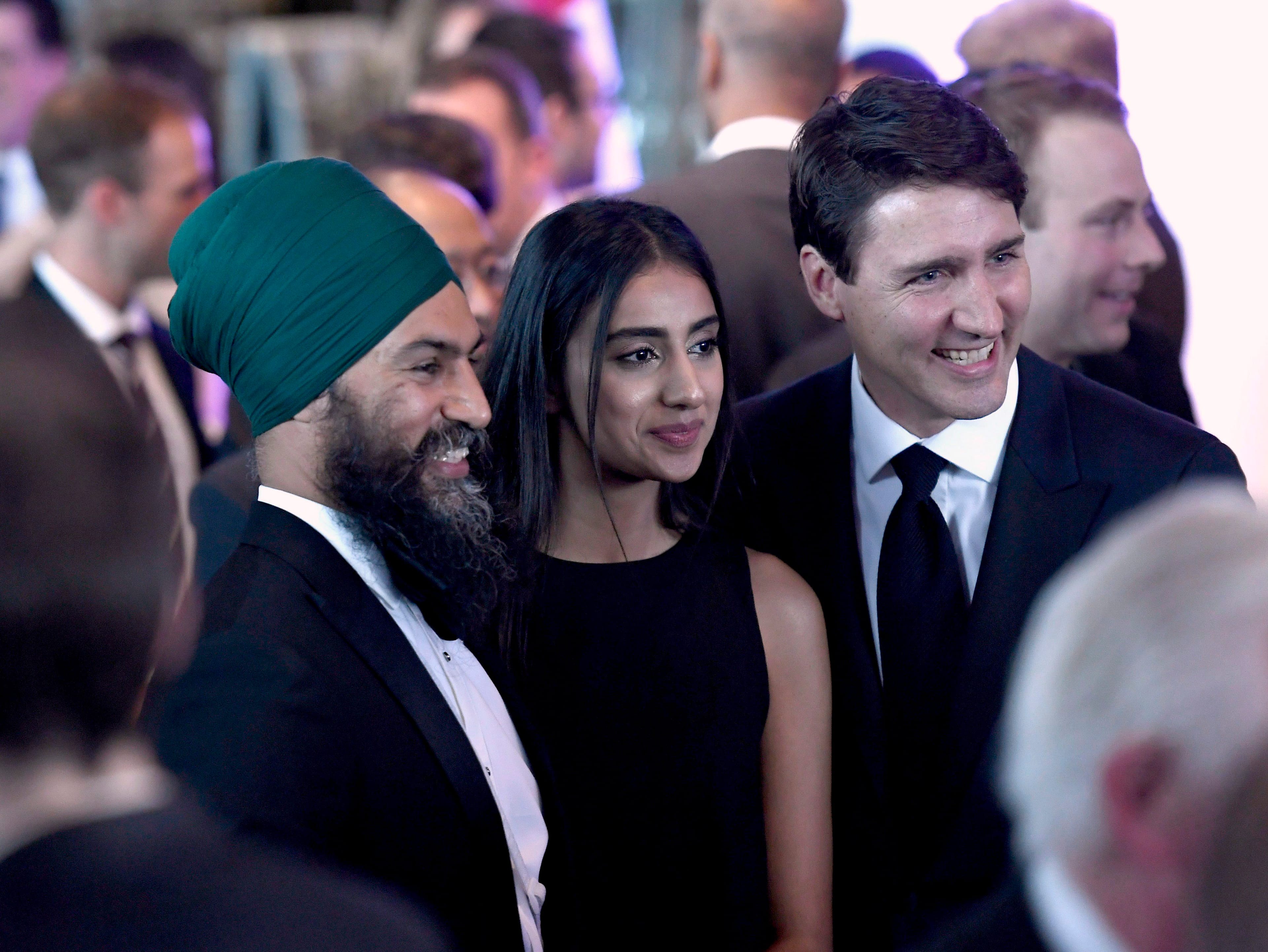 Prime Minister Justin Trudeau poses for a photo with NDP Leader Jagmeet Singh and his wife Gurkiran Singh at the Parliamentary Press Gallery Dinner in Gatineau, Que., on Saturday, May 26, 2018. (THE CANADIAN PRESS/Justin Tang)