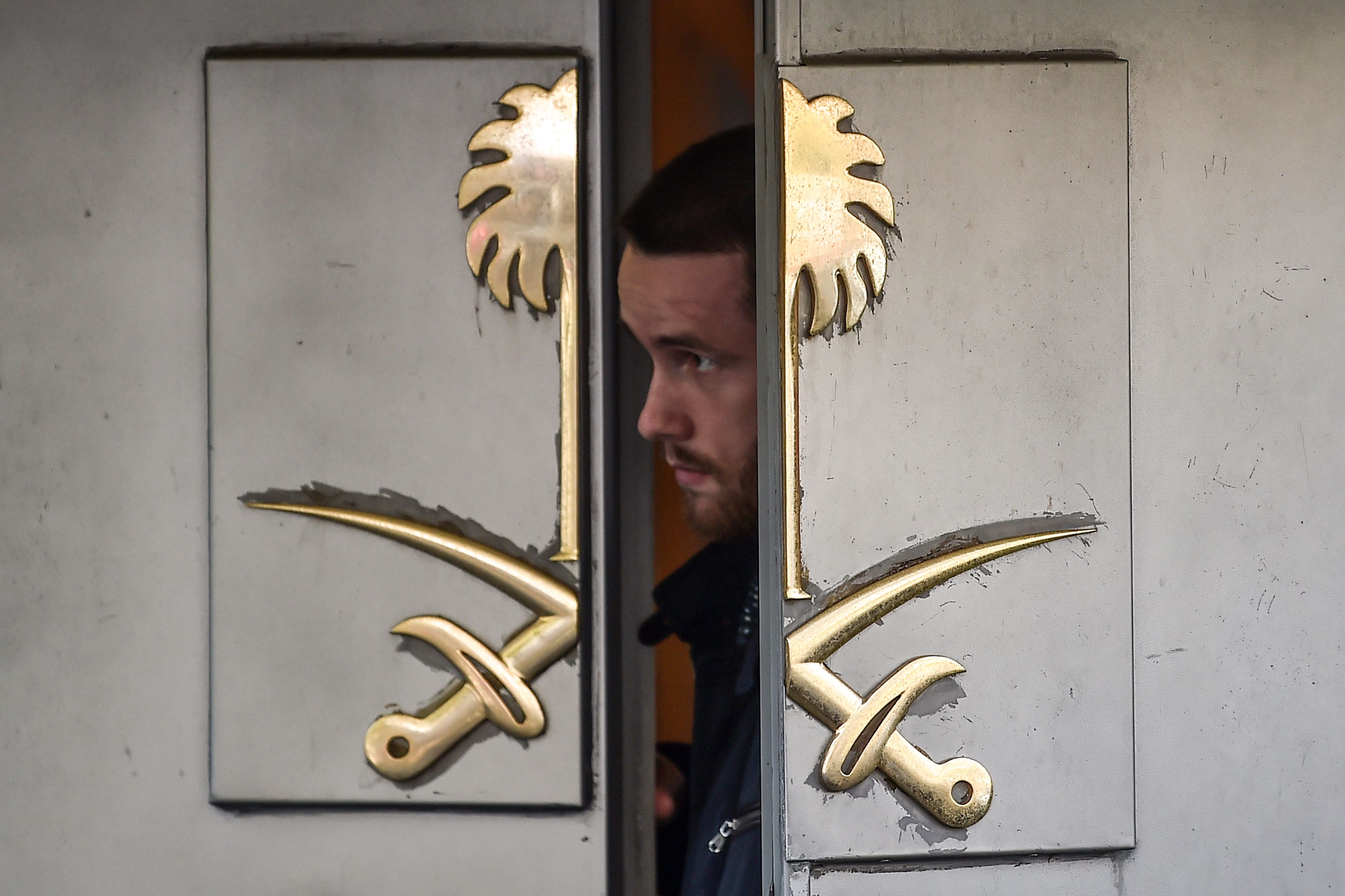 A security member of the consulate looks between the entrance doors of the Saudi Arabian consulate in Istanbul on Oct. 12, 2018. (OZAN KOSE/AFP/Getty Images)