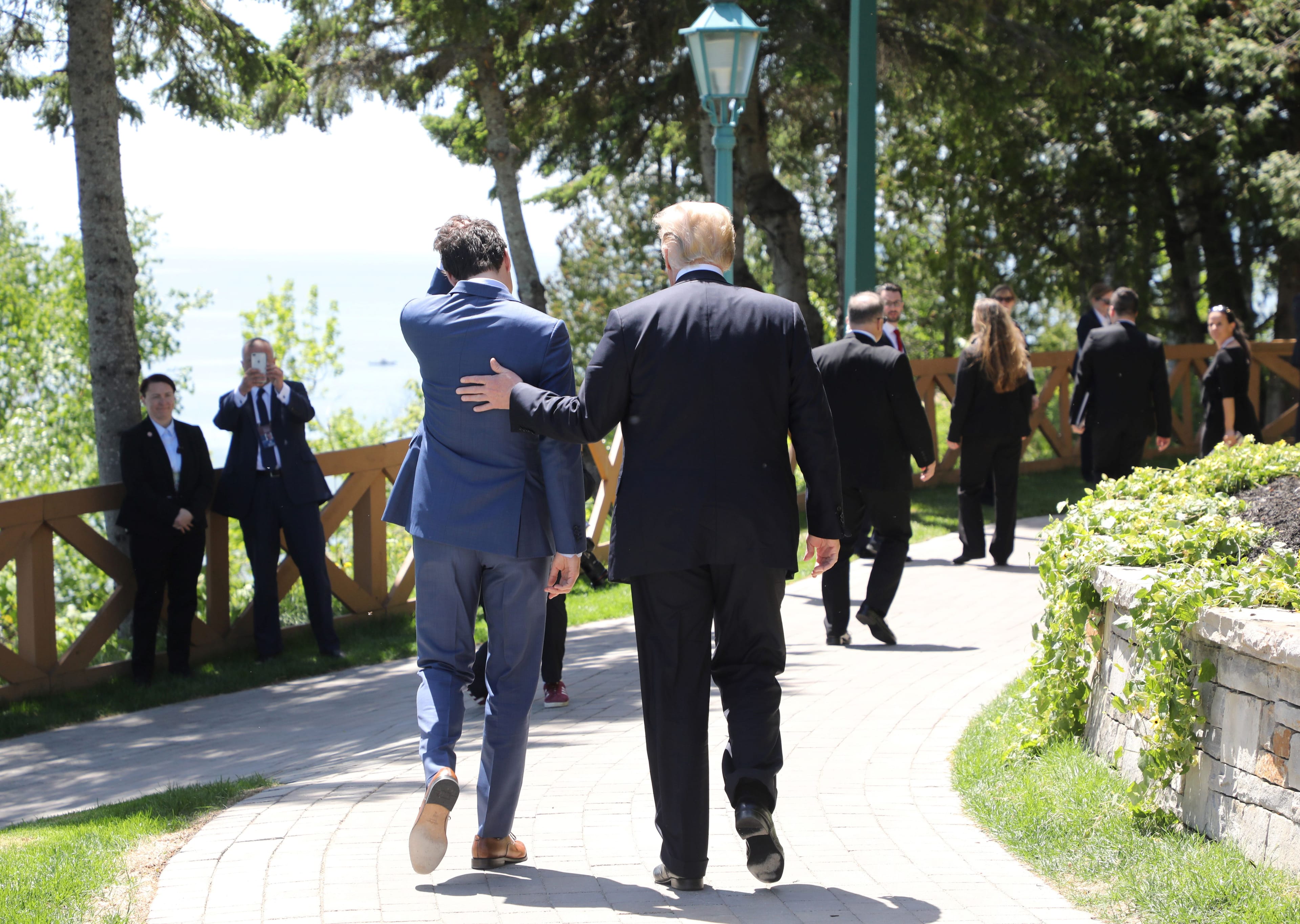 Canadian Prime Minister Justin Trudeau (L) walks with US President Donald Trump during the official G7 Summit welcoming ceremony, June 8, 2018 in La Malbaie, Canada. (Photo by Ludovic MARIN / AFP) / POOL FOR EPA, SIPA, BESTIMAGE        (Photo credit should read LUDOVIC MARIN/AFP/Getty Images)