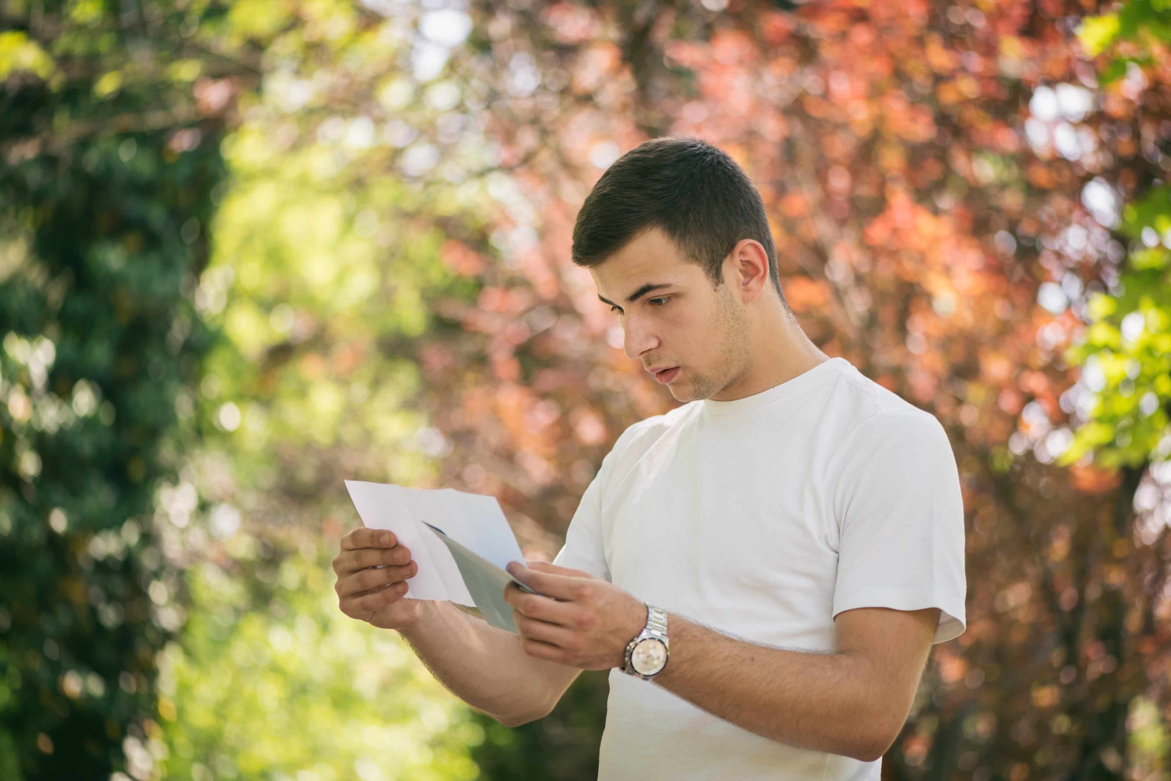 Young man receiving bad letter