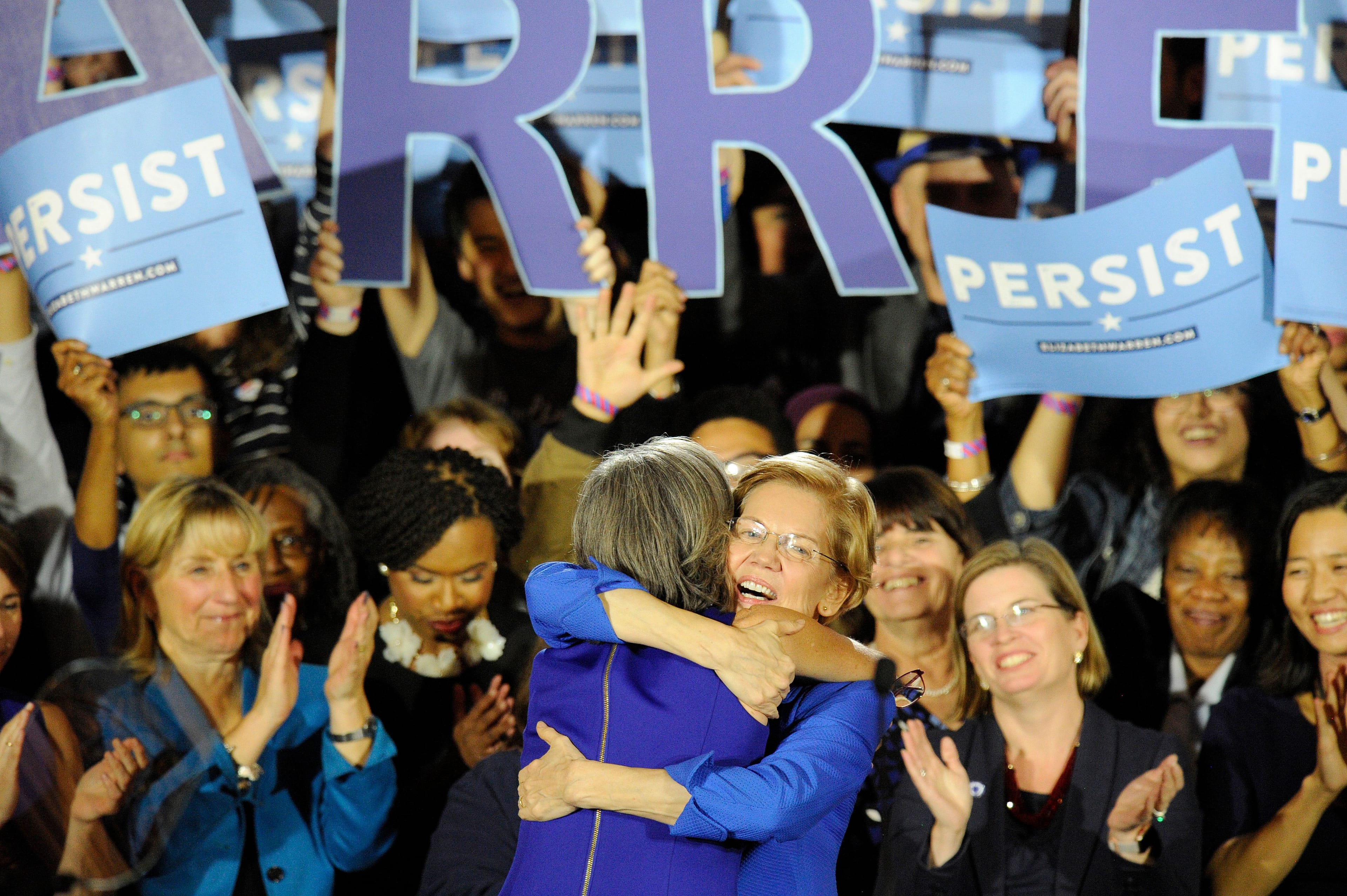 Senator Elizabeth Warren embraces Congresswoman Katherine Clark before she addresses the audience during the Election Day Massachusetts Democratic Coordinated Campaign Election Night Celebration in Boston on Nov. 6, 2018 (JOSEPH PREZIOSO/AFP/Getty Images)
