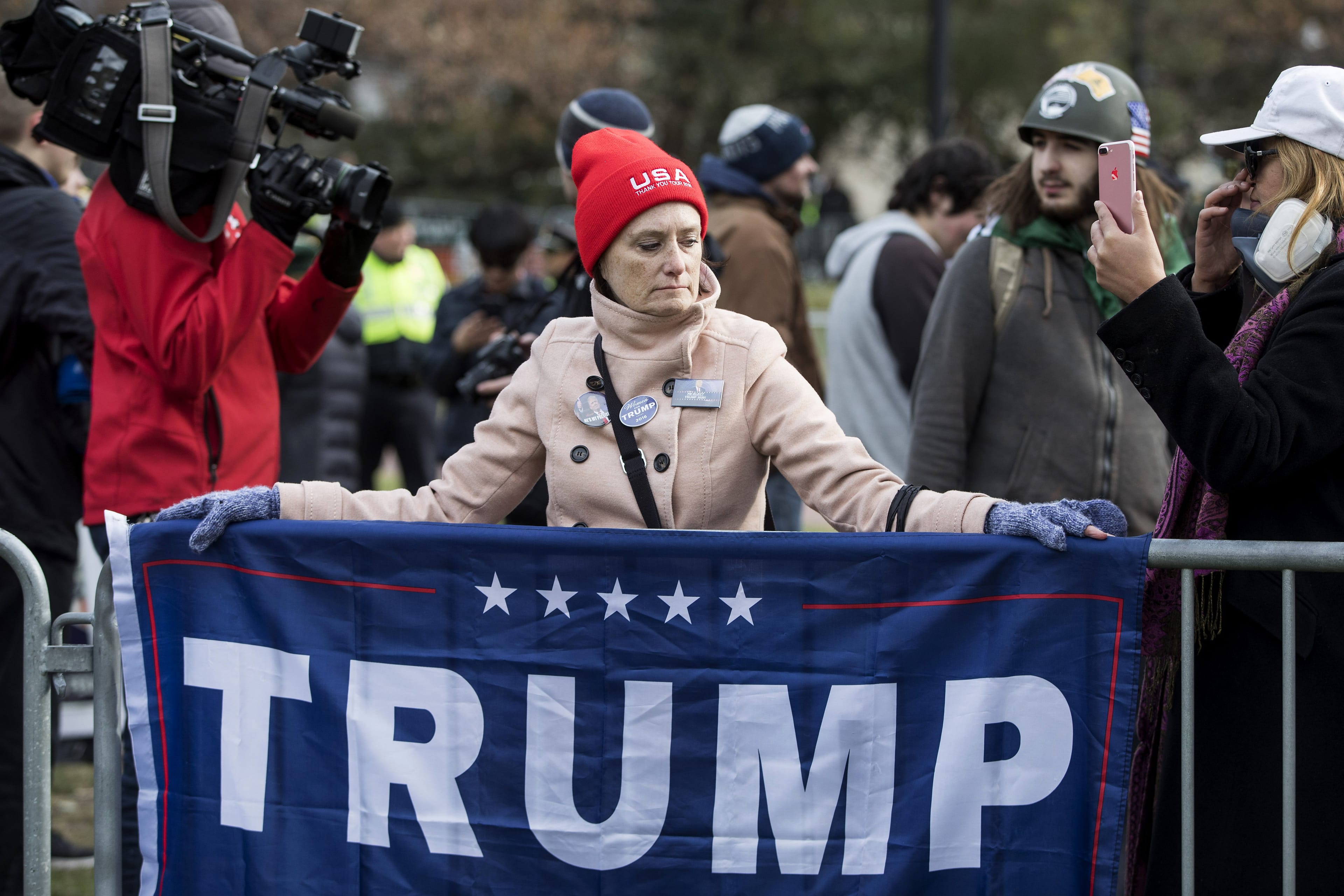 A supporter drapes a Trump campaign flag at the Boston Common on Nov. 18, 2017 in Boston, Mass. (Scott Eisen/Getty Images)