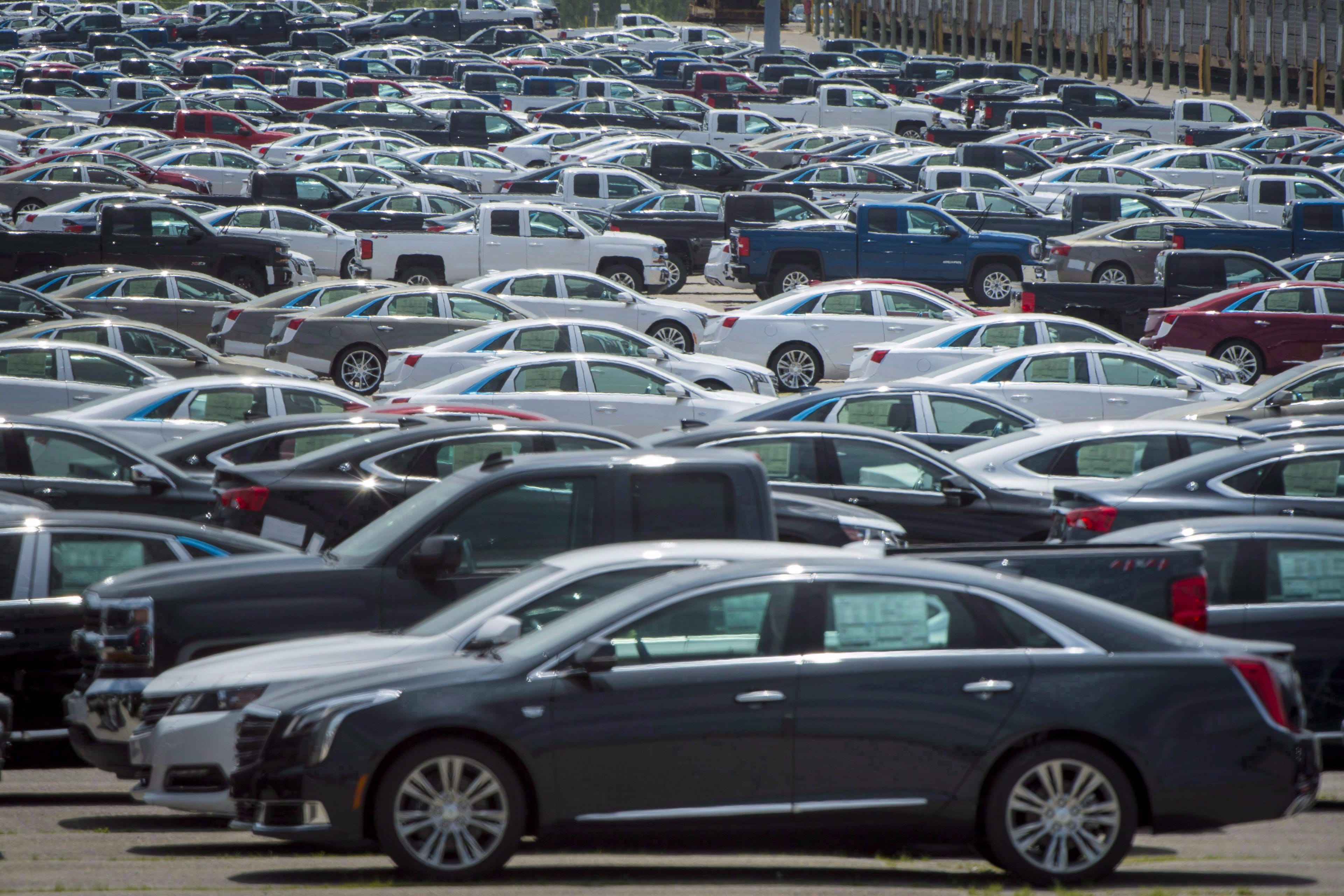 Vehicles are seen in a parking lot at the General Motors Oshawa Assembly Plant THE CANADIAN PRESS/Tijana Martin