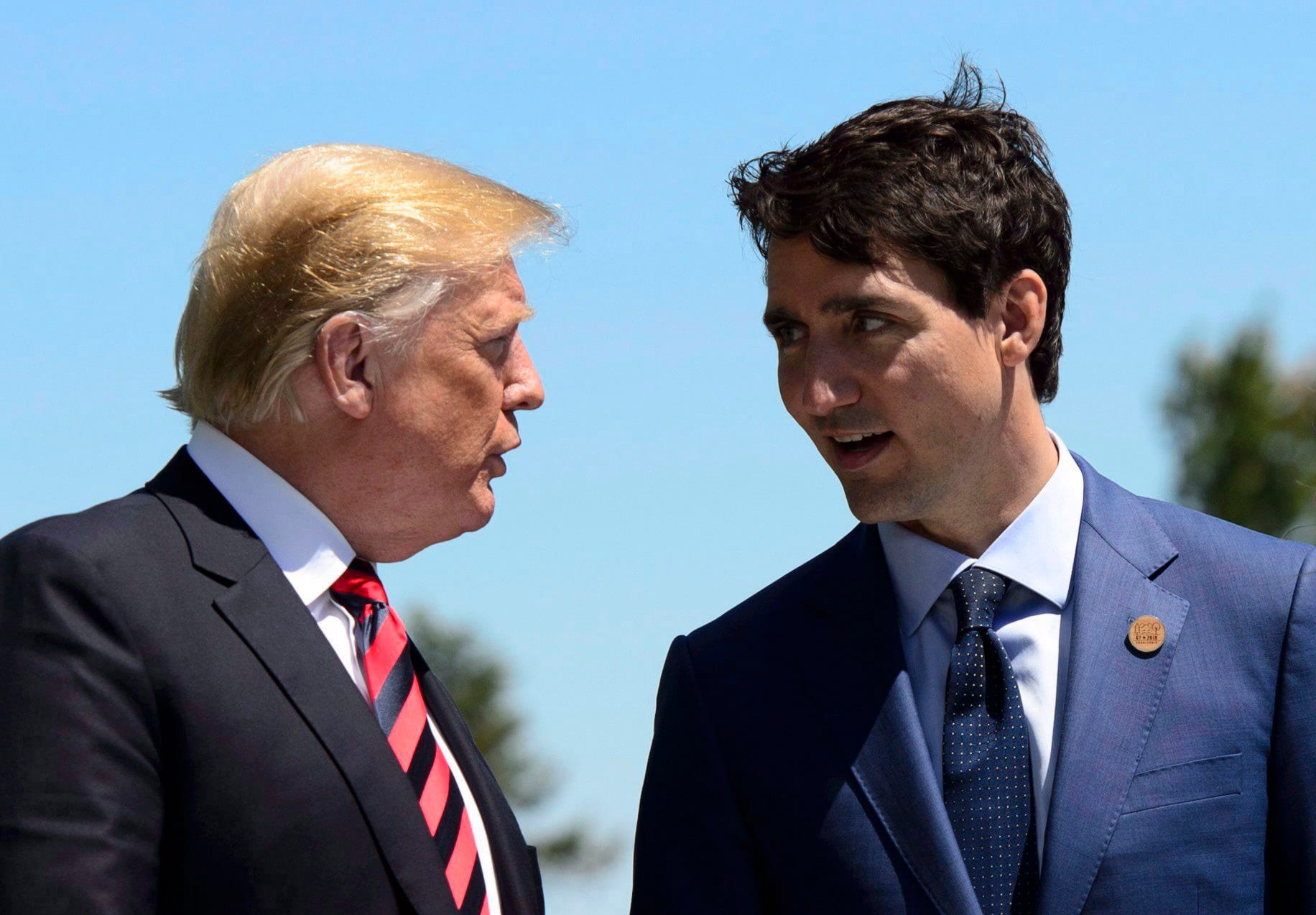 Justin Trudeau greets Donald Trump during the official welcoming ceremony at the G7 Leaders Summit in La Malbaie, Que., on June 8, 2018. (THE CANADIAN PRESS/Sean Kilpatrick)