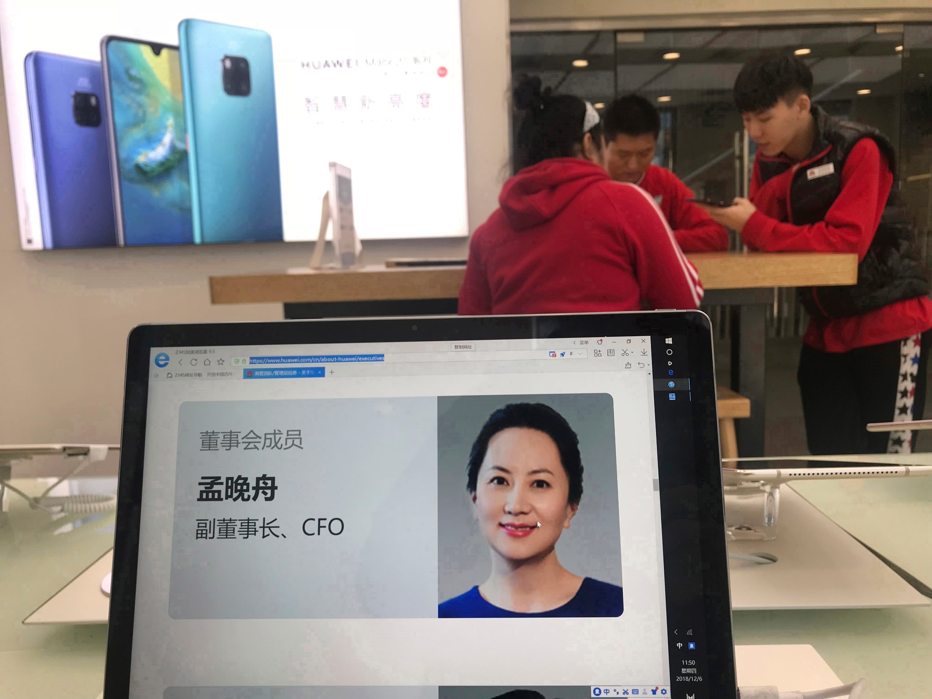 A profile of Huawei's chief financial officer Meng Wanzhou is displayed on a Huawei computer at a Huawei store in Beijing, China, Thursday, Dec. 6, 2018. (AP Photo/Ng Han Guan)