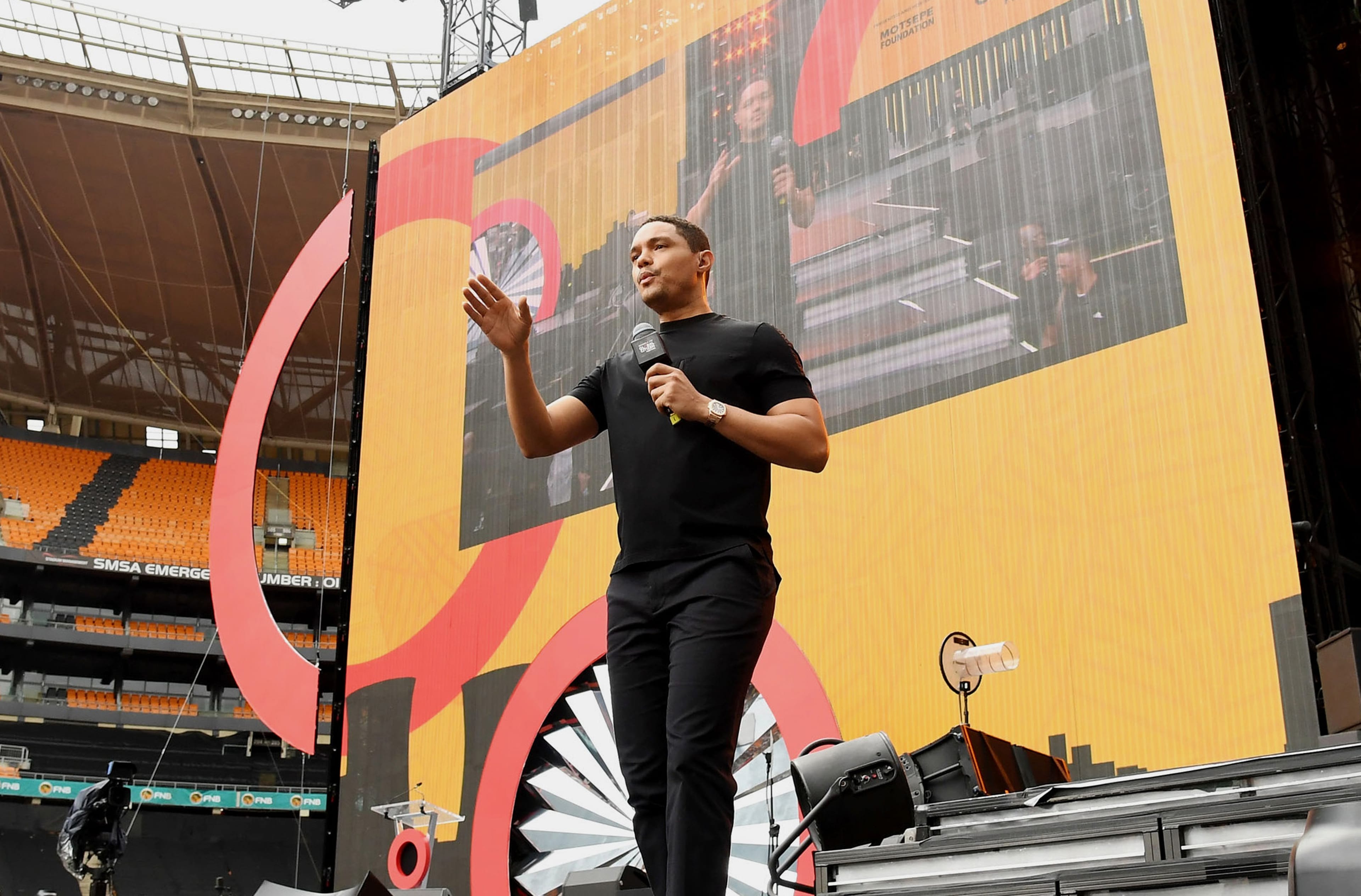 JOHANNESBURG, SOUTH AFRICA - DECEMBER 02:  Trevor Noah speaks onstage during the Global Citizen Festival: Mandela 100 at FNB Stadium on December 2, 2018 in Johannesburg, South Africa.  (Photo by Kevin Mazur/Getty Images for Global Citizen Festival: Mandela 100)