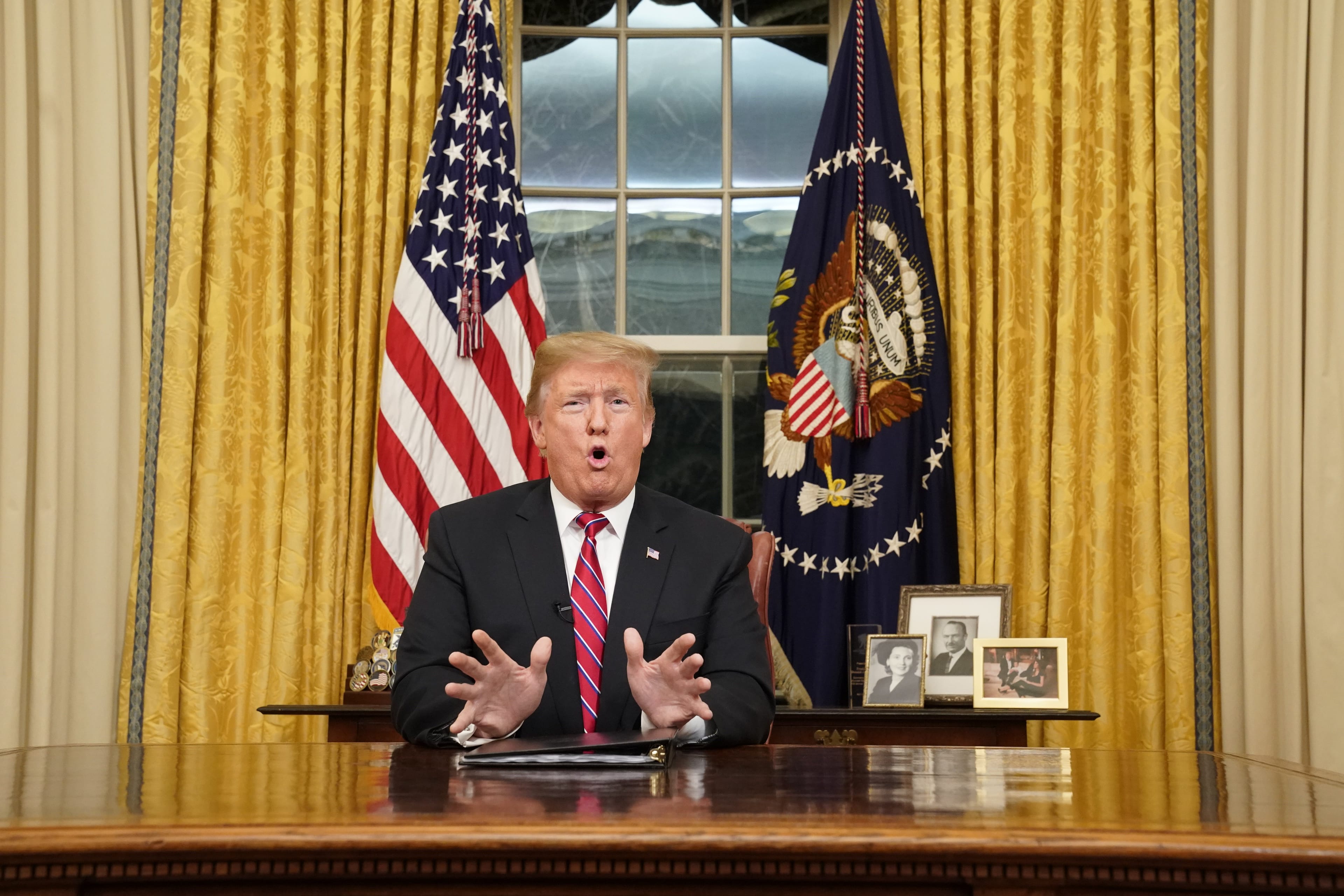 Trump speaks in his first prime-time address from the Oval Office in an effort to build support for $5.7 billion in funding for a border wall (Sandy Huffaker/Getty Images)