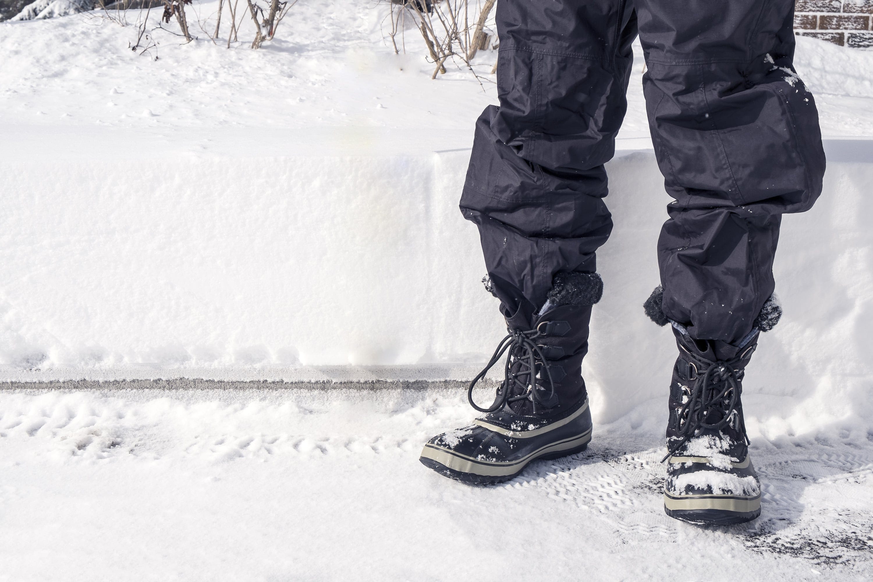 A grown-up in snow pants. (Shutterstock)