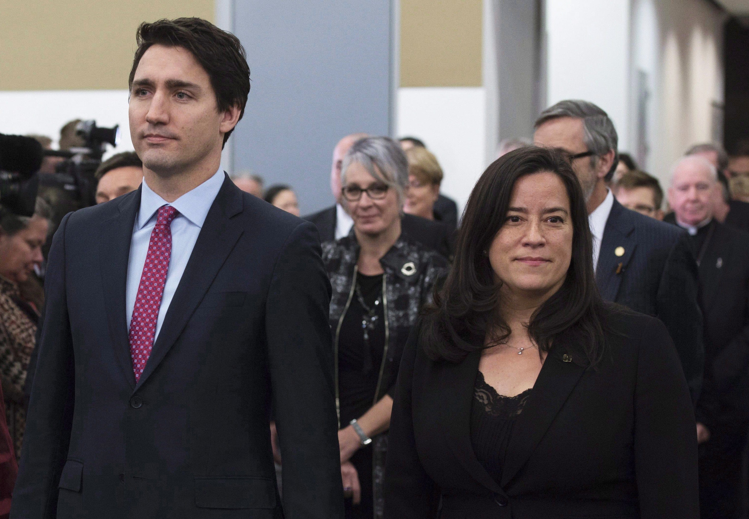 Trudeau and Wilson-Raybould take part in the grand entrance as the final report of the Truth and Reconciliation commission is released on Tuesday, Dec. 15, 2015, in Ottawa. (THE CANADIAN PRESS/Adrian Wyld)