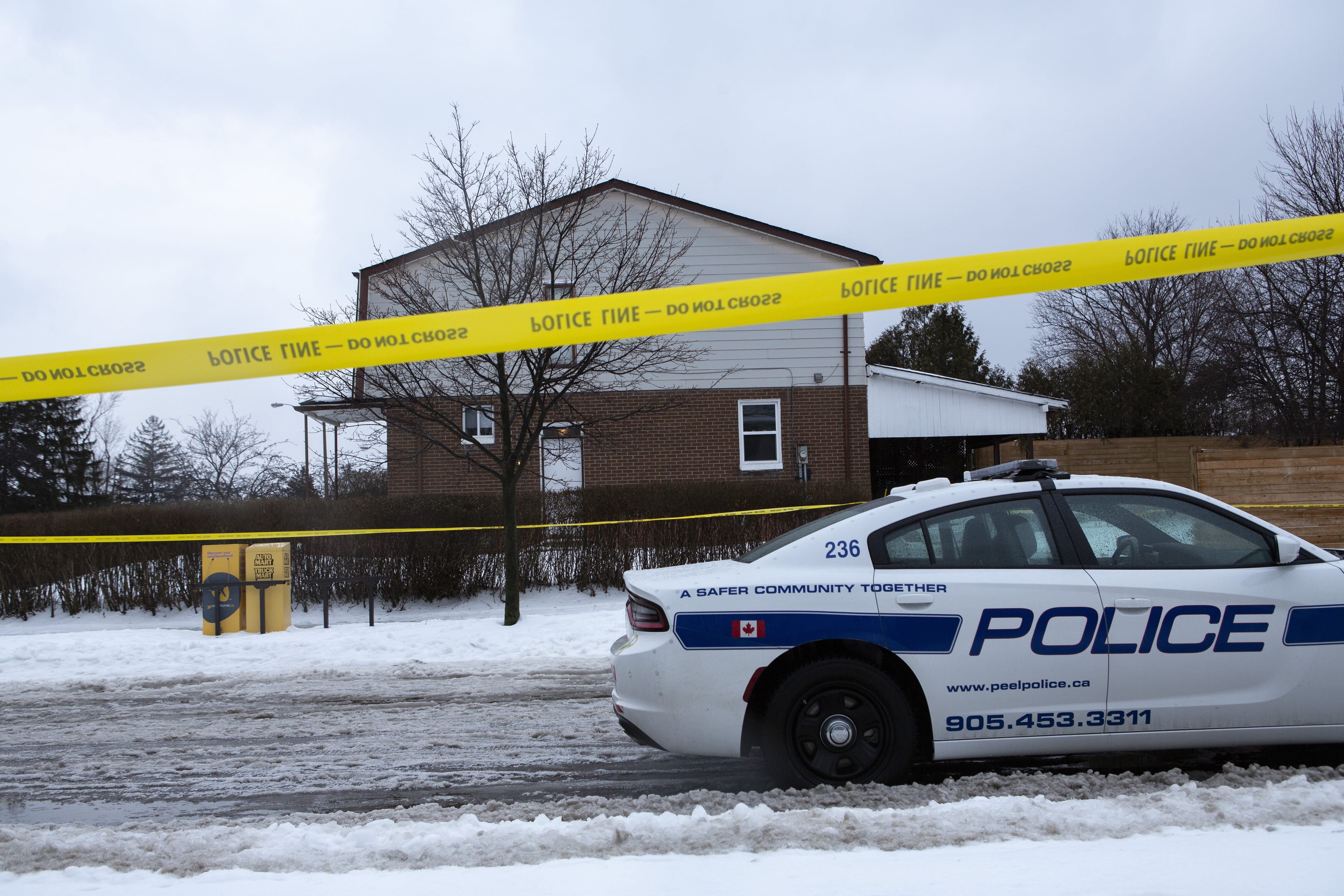 The scene at a house where a young girl was found dead in Brampton, Ont. on Friday. The father of an 11-year-old girl was in police custody and facing charges in his daughter's death (Andrew Ryan/CP)