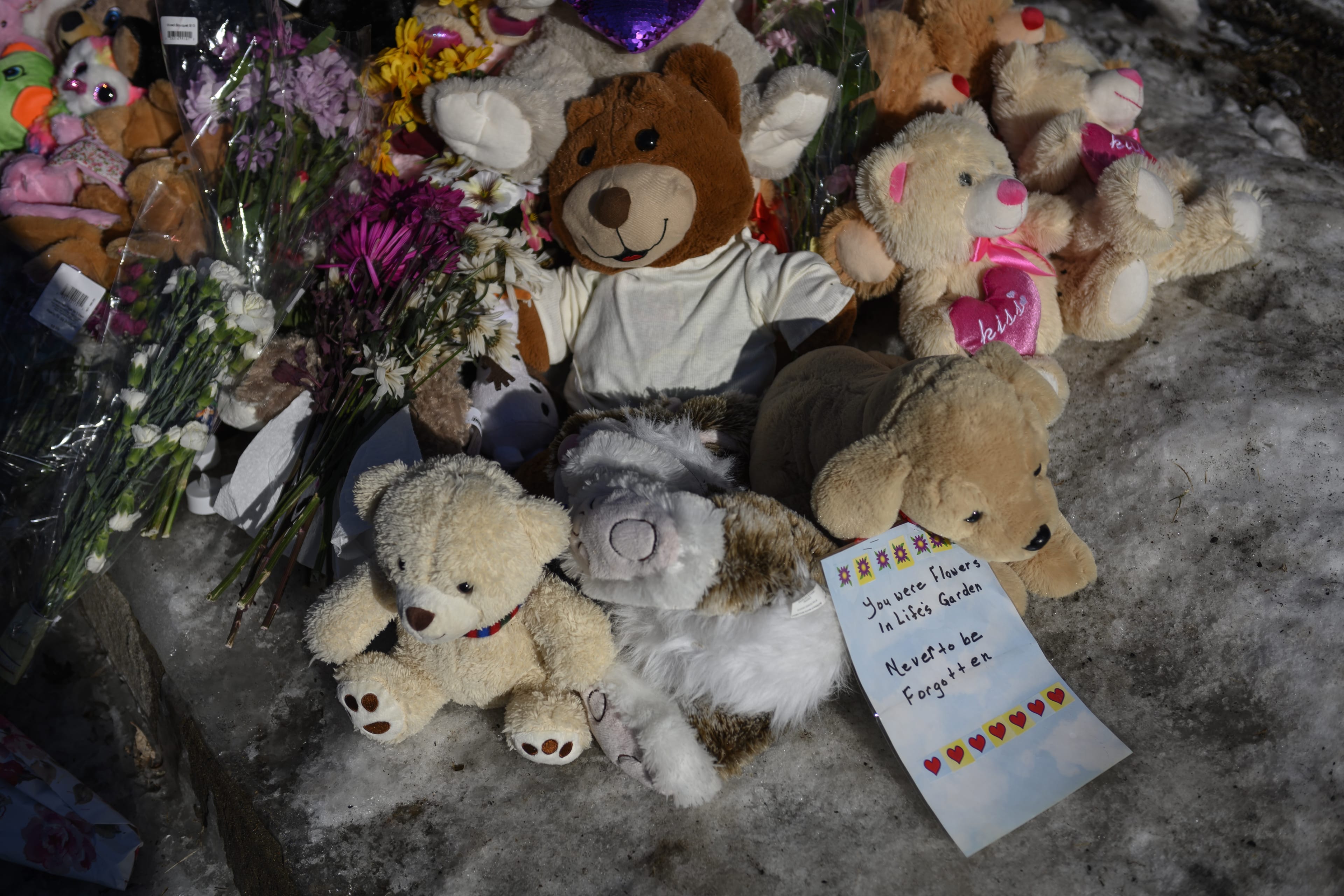 A memorial of flowers and stuffed animal toys outside the scene of a fatal house fire in Spryfield, N.S., near Halifax; the blaze claimed the lives of seven Syrian refugee children and left their father severely burned THE CANADIAN PRESS/Darren Calabrese